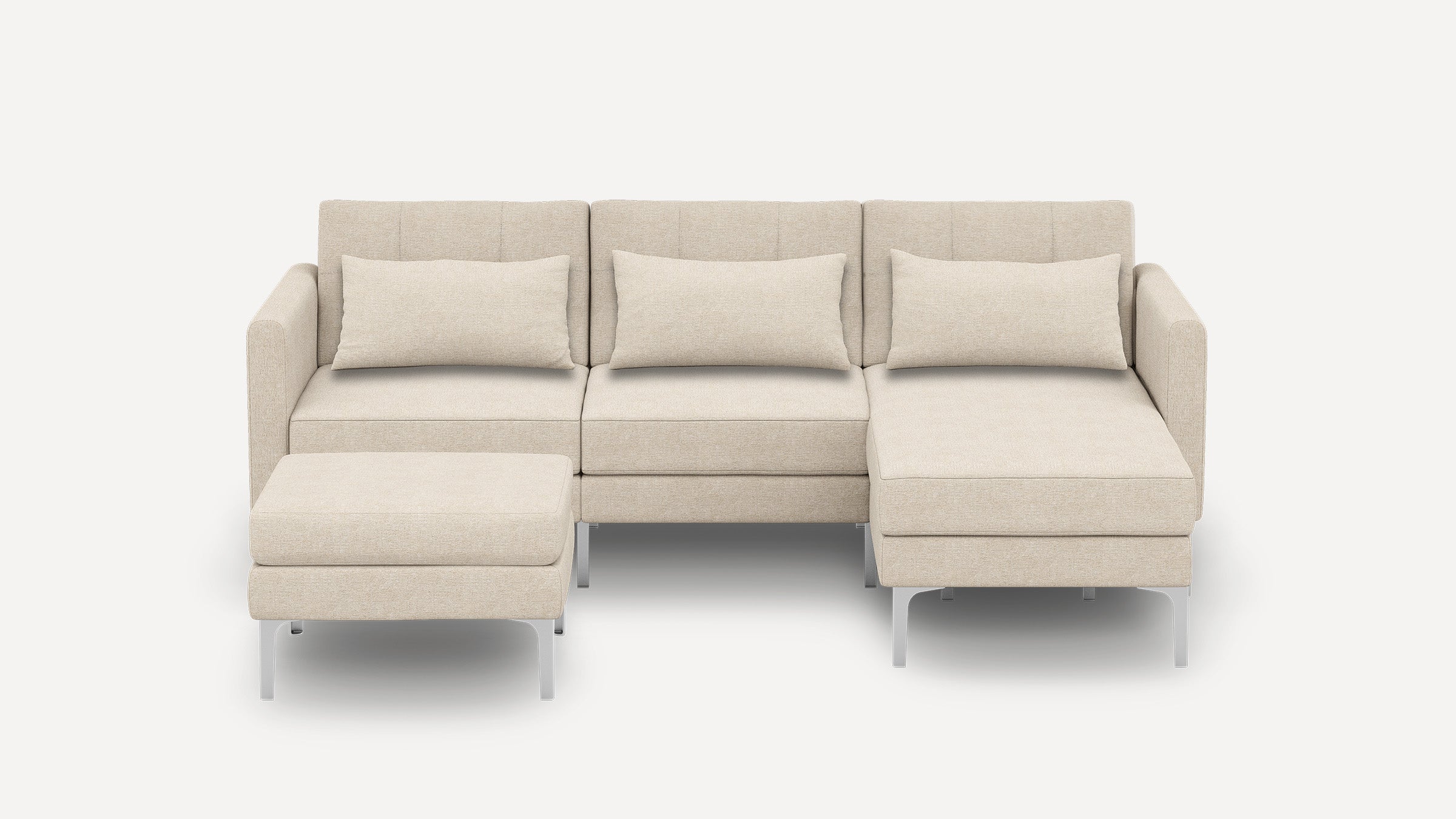 Beige modern sectional sofa with three back cushions, clean lines, metal legs, and a matching ottoman on a white background.