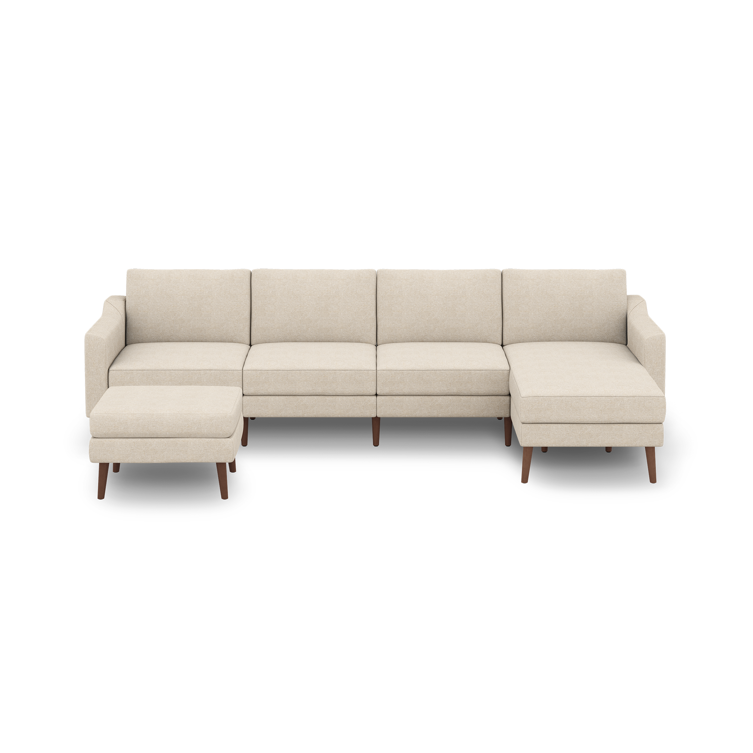 Beige L-shaped sectional sofa with four cushioned seats, a chaise lounge on the right, and a matching ottoman on the left, all elevated on wooden legs.