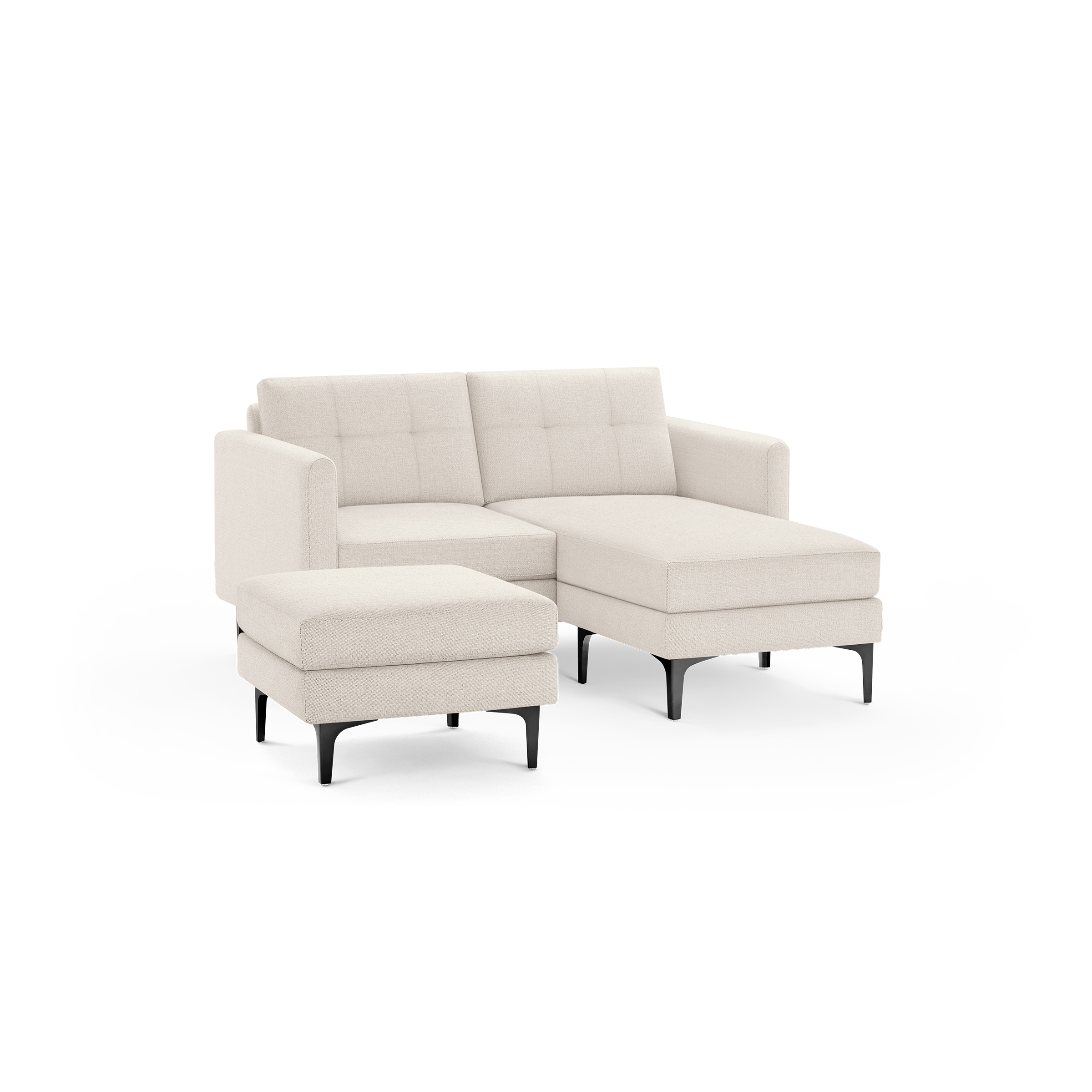Light beige fabric sectional sofa with tufted back cushions and matching ottoman, supported by black legs.