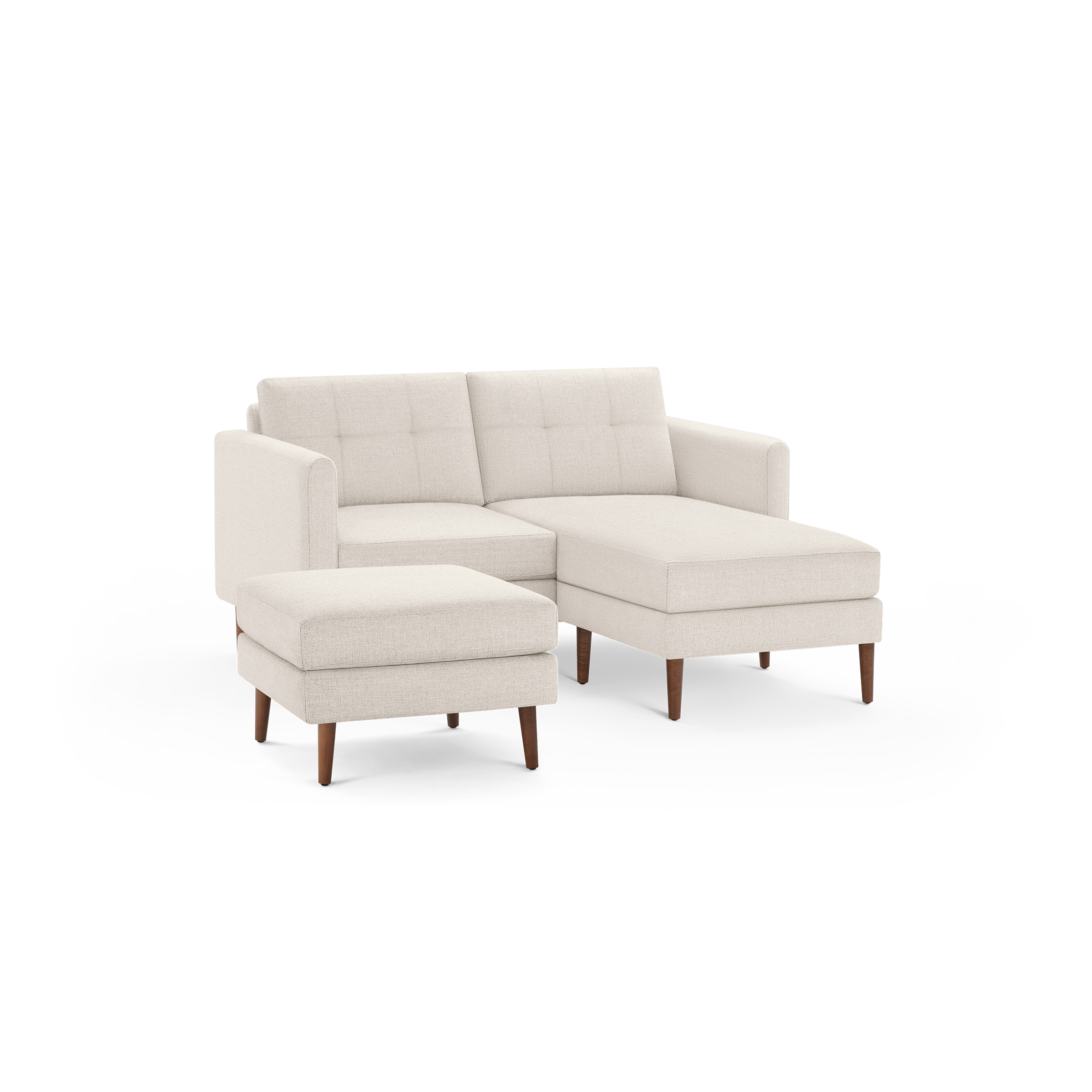 Beige fabric sectional sofa with tufted back cushions, wooden legs, and a matching ottoman.