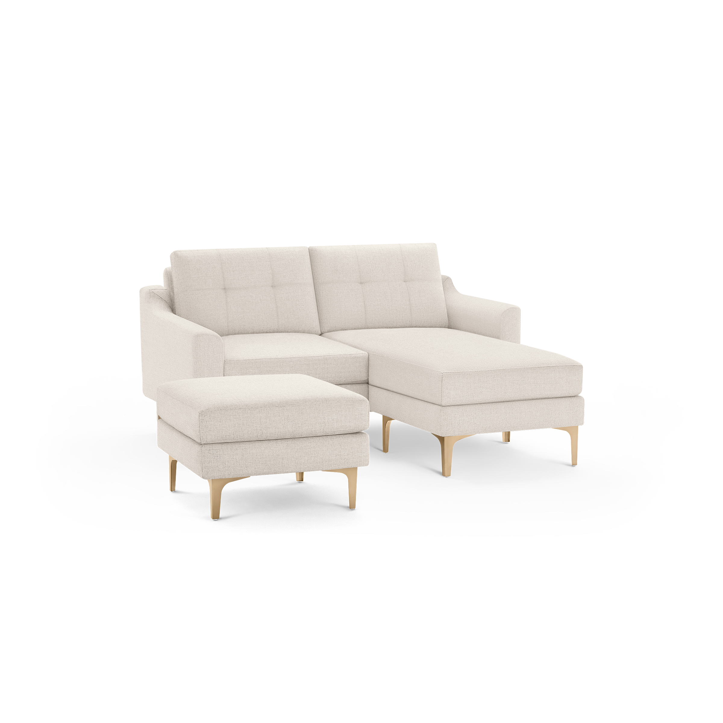 Cream-colored modern sectional sofa with tufted back cushions, wooden legs, and matching ottoman isolated on black background.
