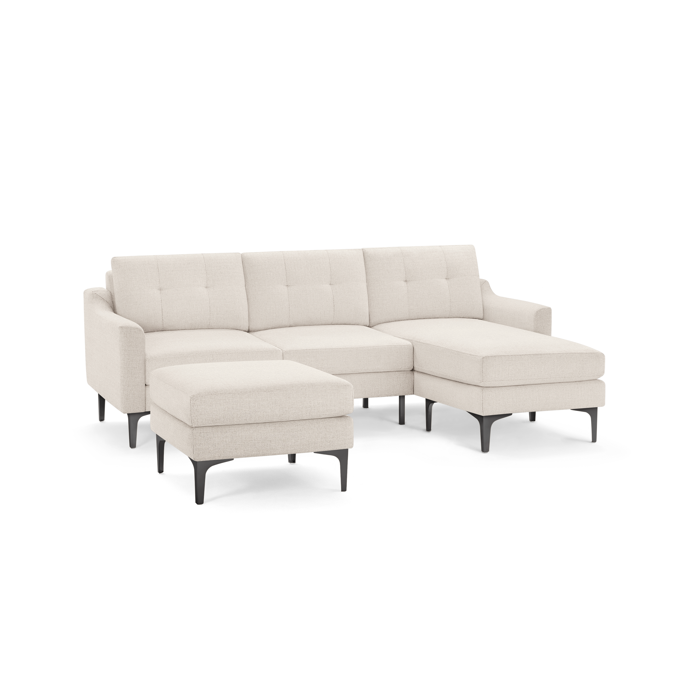 Modern beige fabric sectional sofa with tufted back cushions, right chaise, reversed ottoman, and black angled legs.