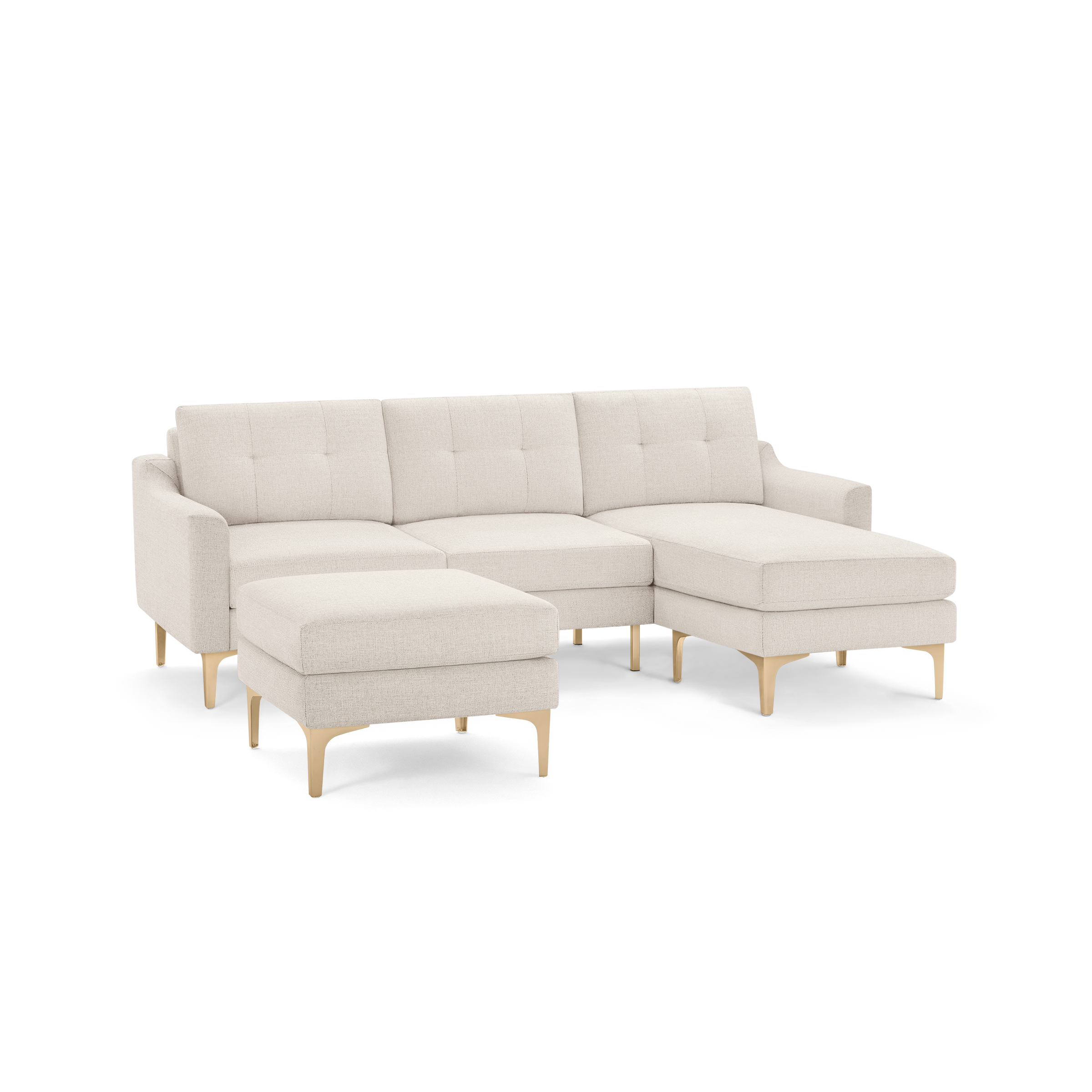 Beige fabric sectional sofa with tufted back cushions, wooden legs, and matching ottoman on front left side.