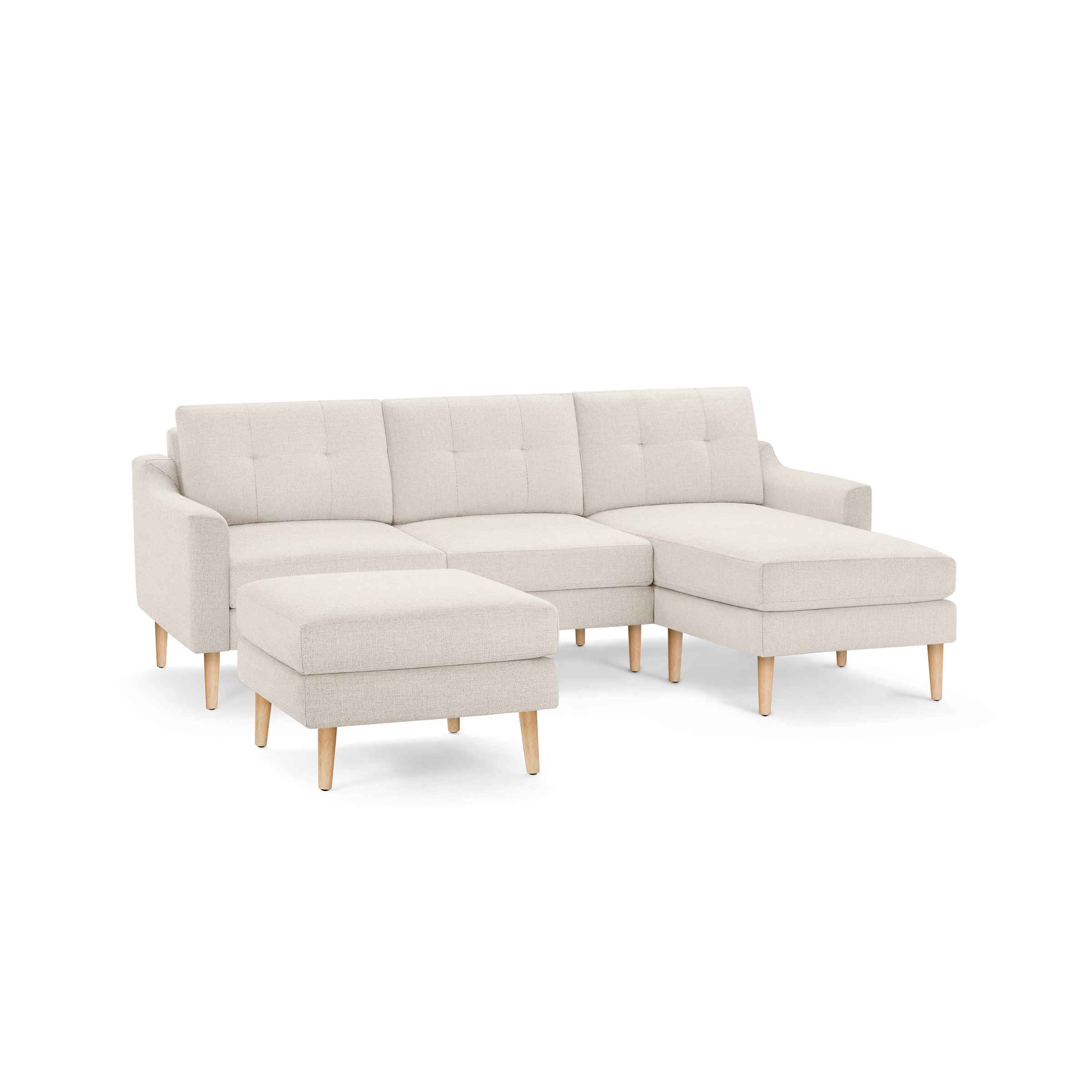 Beige fabric sectional sofa with tufted back cushions, wooden legs, and a matching ottoman, designed for modern living spaces.
