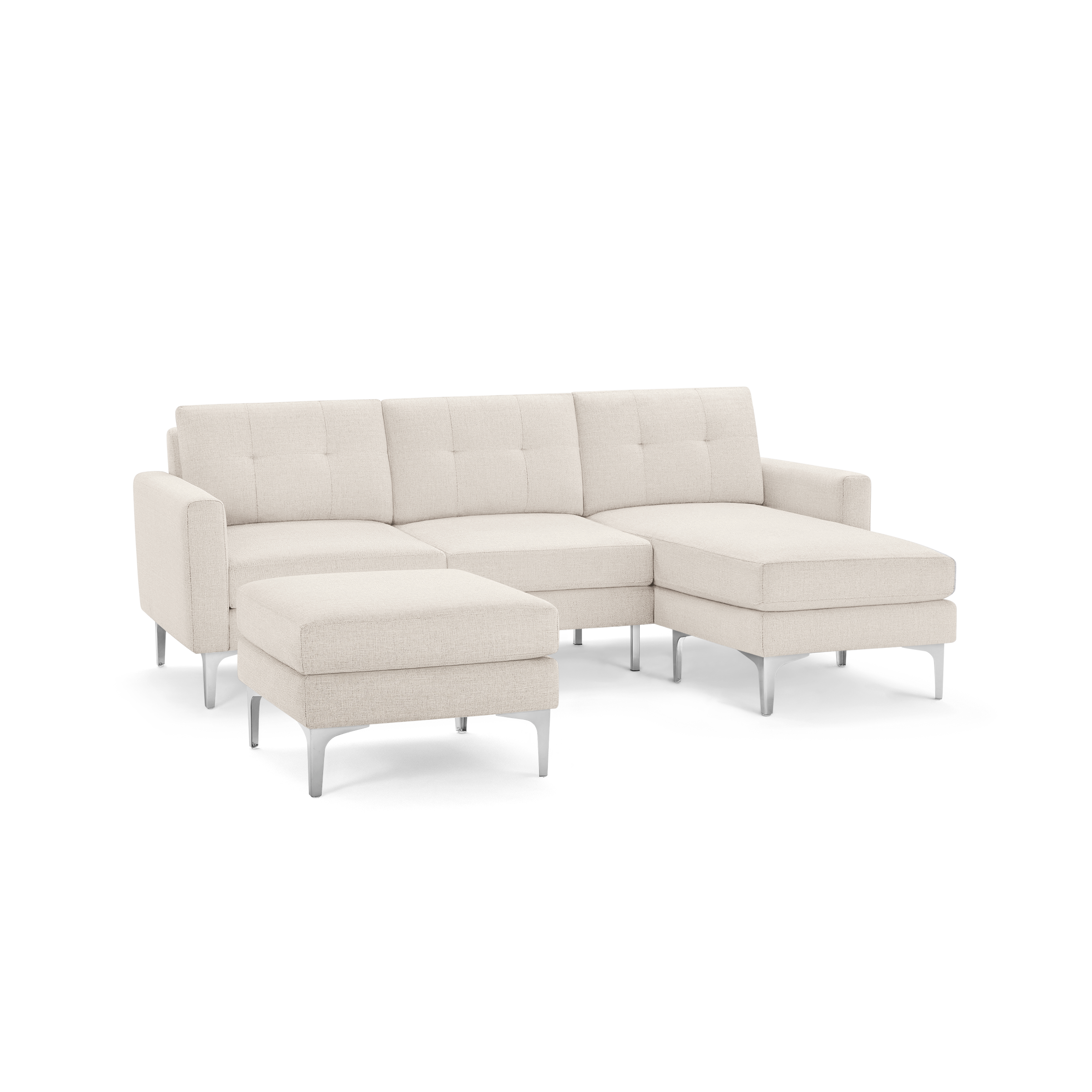 Modern beige fabric sectional sofa with tufted back cushions, metal legs, and a removable ottoman.