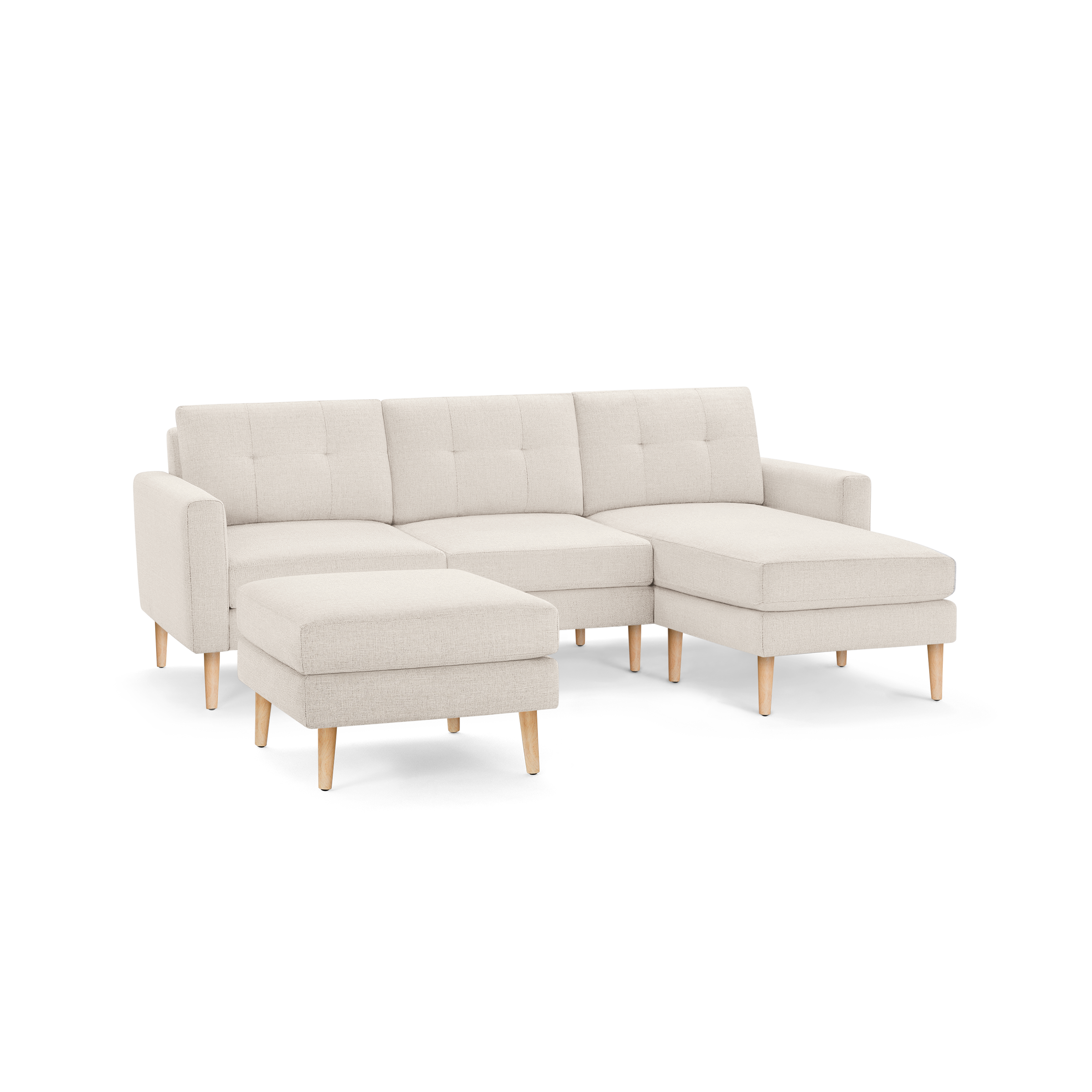 Beige modern sectional sofa with tufted cushions, wooden legs, and matching ottoman, offering comfortable seating and chaise lounge.