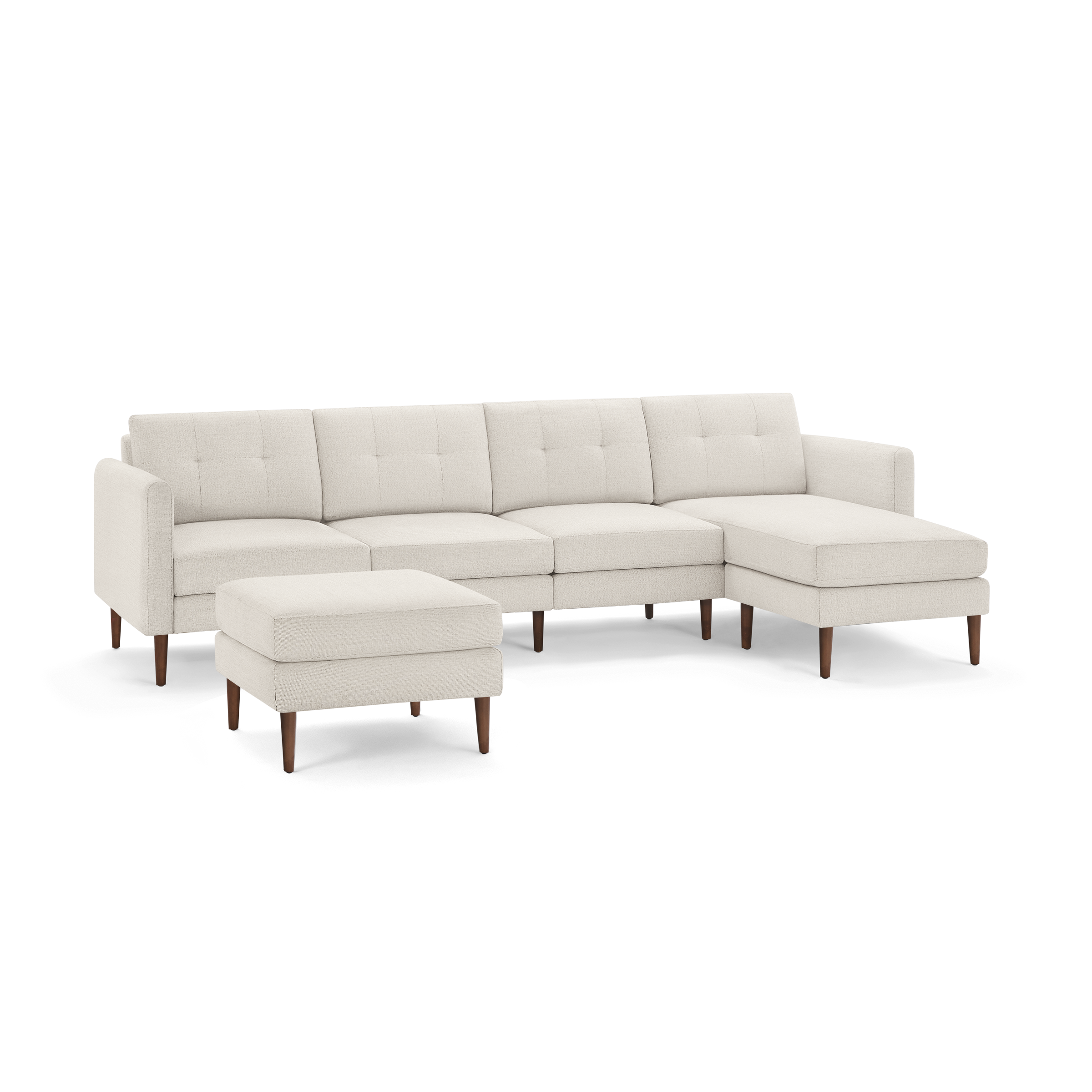 Beige sectional sofa with tufted cushions, wooden legs, and a matching ottoman, featuring a modern and minimalist design.