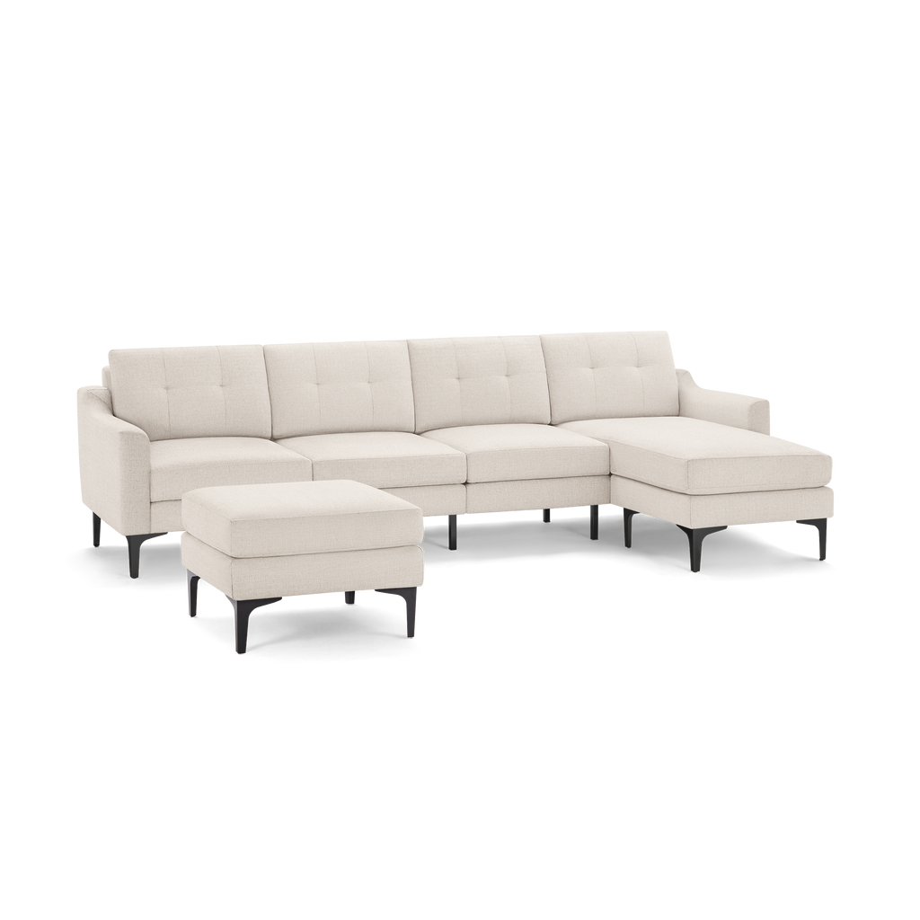 Light beige modern sectional sofa with tufted cushions, right chaise, and matching ottoman on black legs.