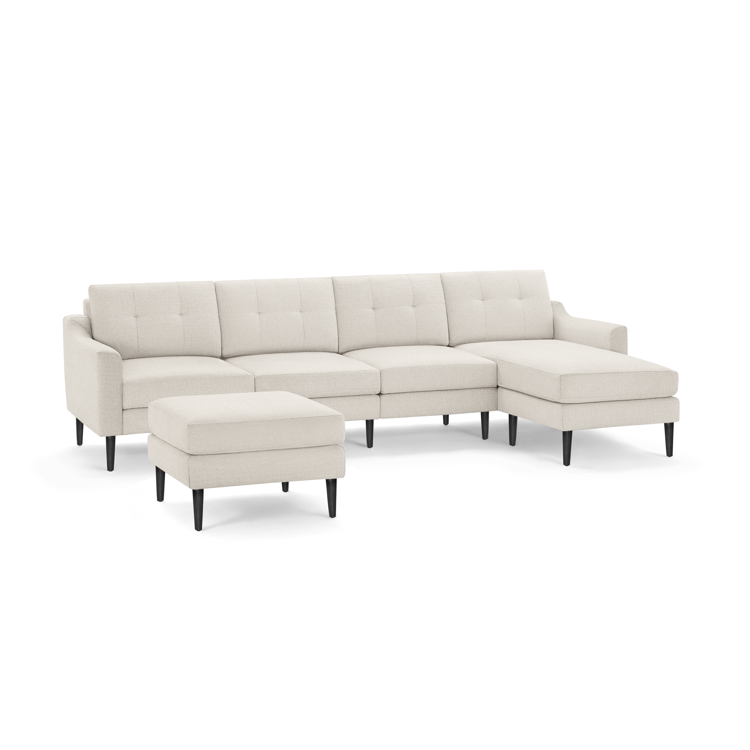Beige upholstered modern sectional sofa with tufted back cushions, armrests, black tapered legs, and matching ottoman on a white background.