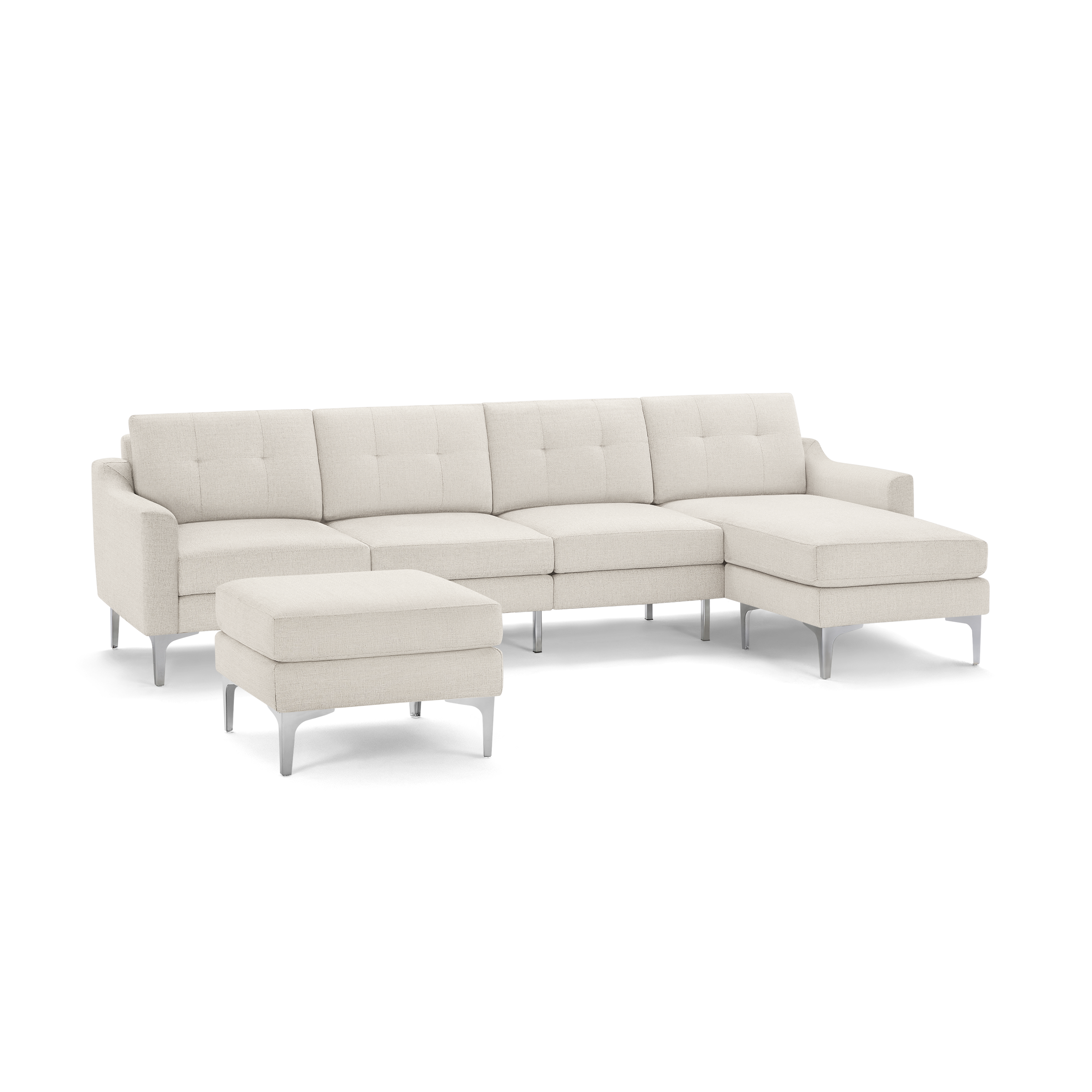 Modern beige fabric sectional sofa with tufted back cushions, metal legs, and a matching ottoman.