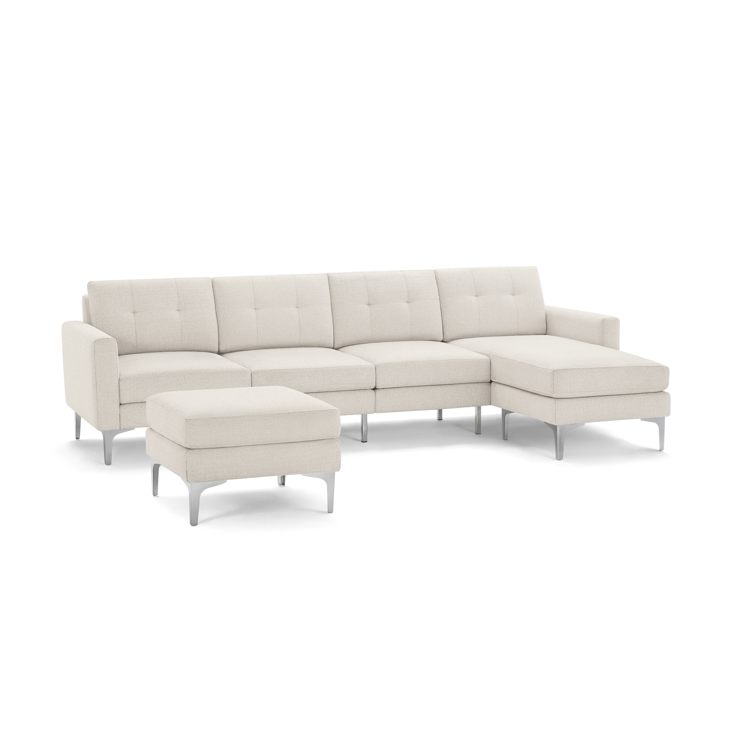 Modern beige sectional sofa with tufted cushions, metal legs, and matching ottoman on a black background.