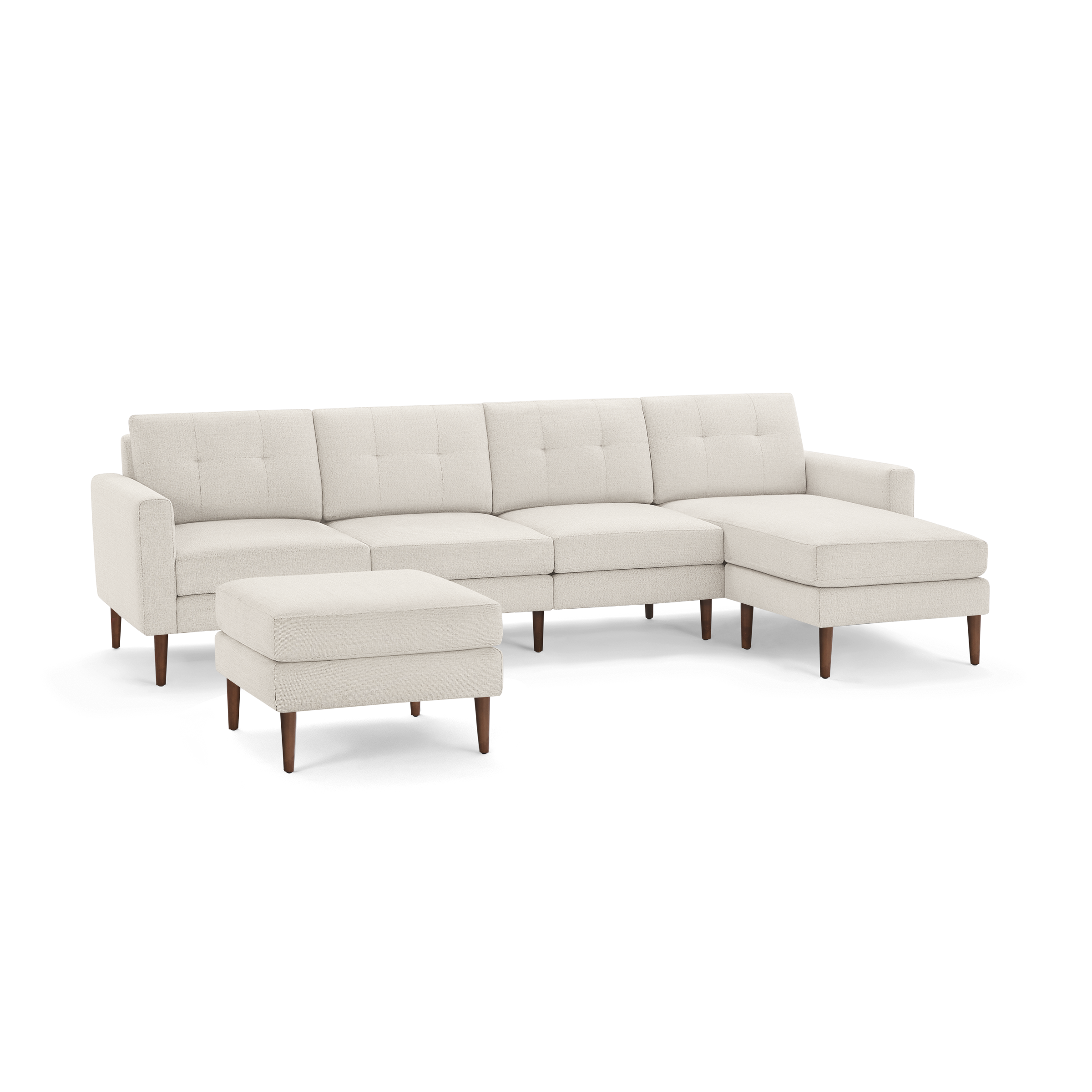 Beige fabric sectional sofa with button-tufted cushions, wooden legs, and a matching ottoman, displayed on white background.