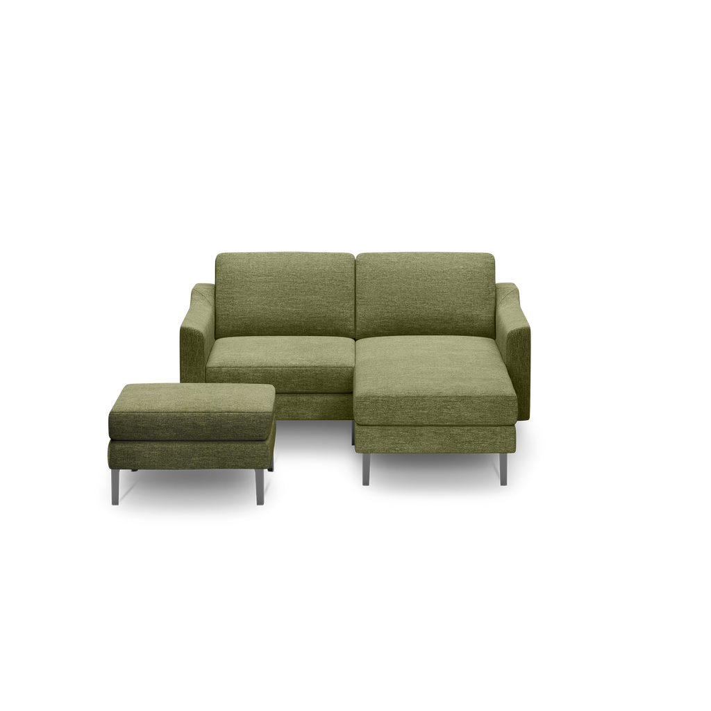 Modern olive green fabric sectional sofa with chaise lounge and matching ottoman, featuring metal legs and clean lines.