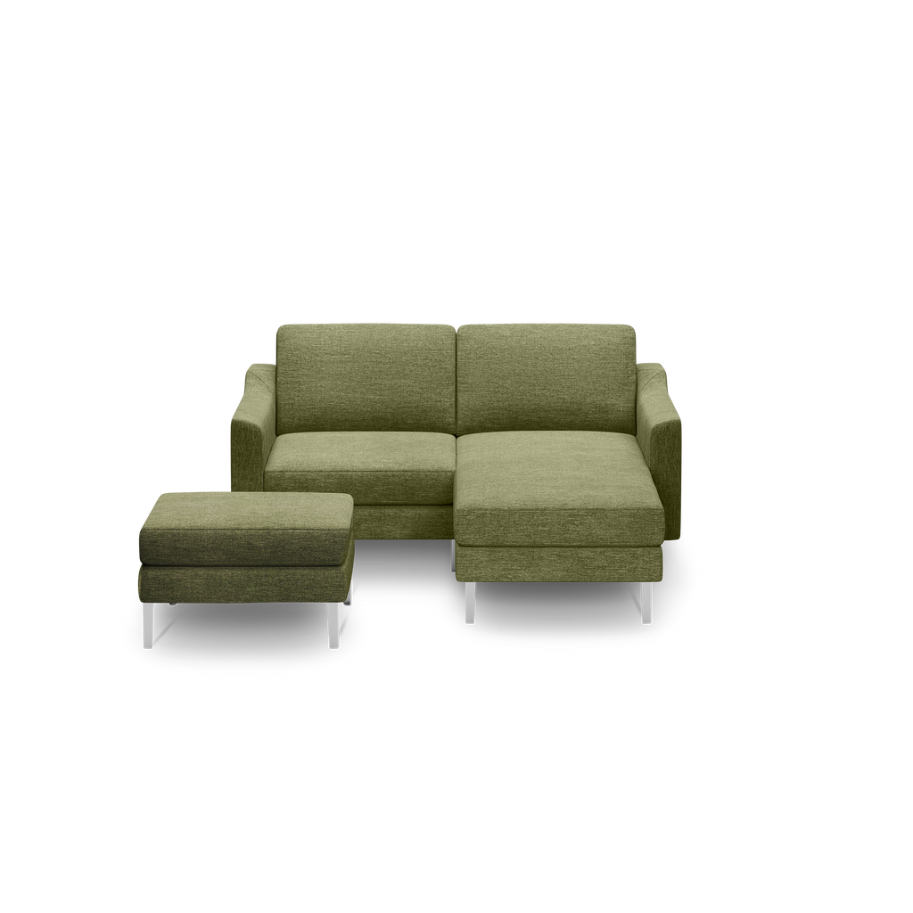 Modern olive green fabric sectional sofa with right chaise and matching ottoman, featuring sleek silver metal legs.