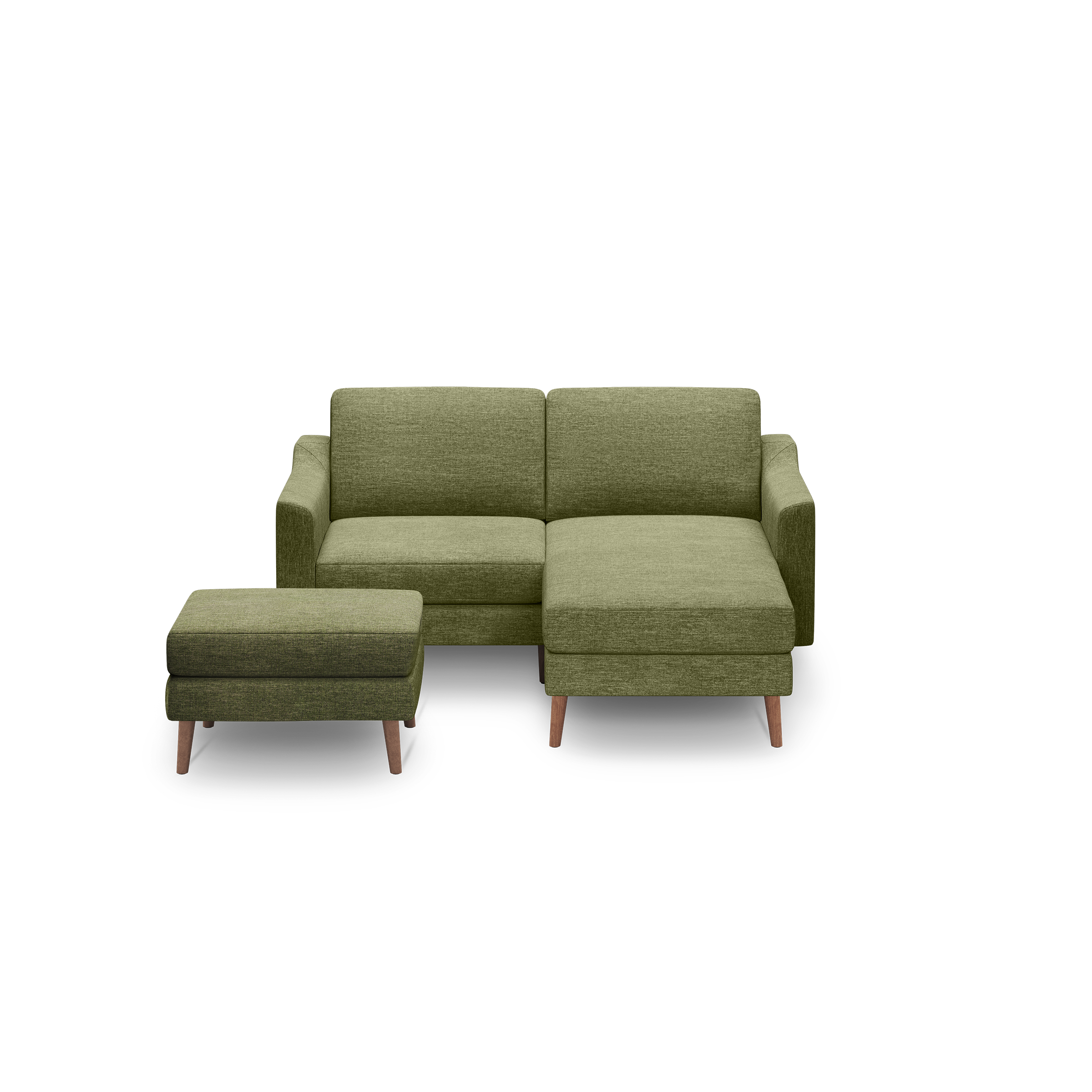 Green fabric L-shaped sectional sofa with wooden legs and matching ottoman, set against black background.