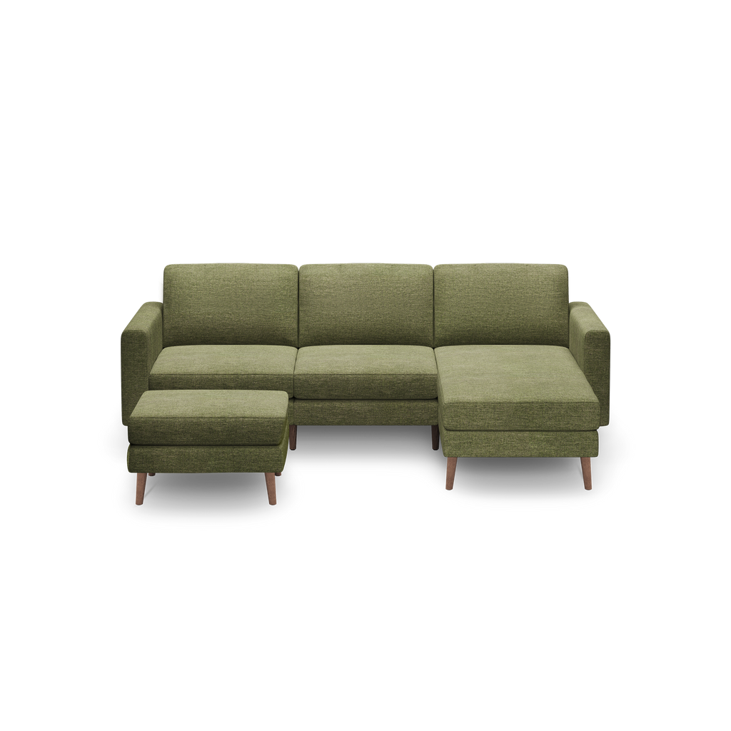 Modern olive green fabric sectional sofa with wooden legs, including a left-side ottoman and a right-side chaise lounge.