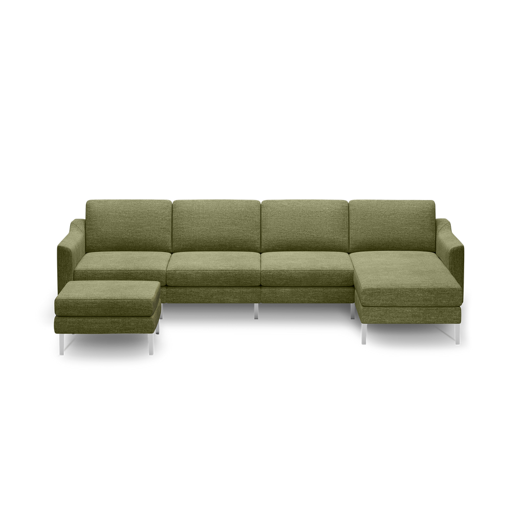 Olive green sectional sofa with modern, clean lines, metal legs, and a matching ottoman on a black background.
