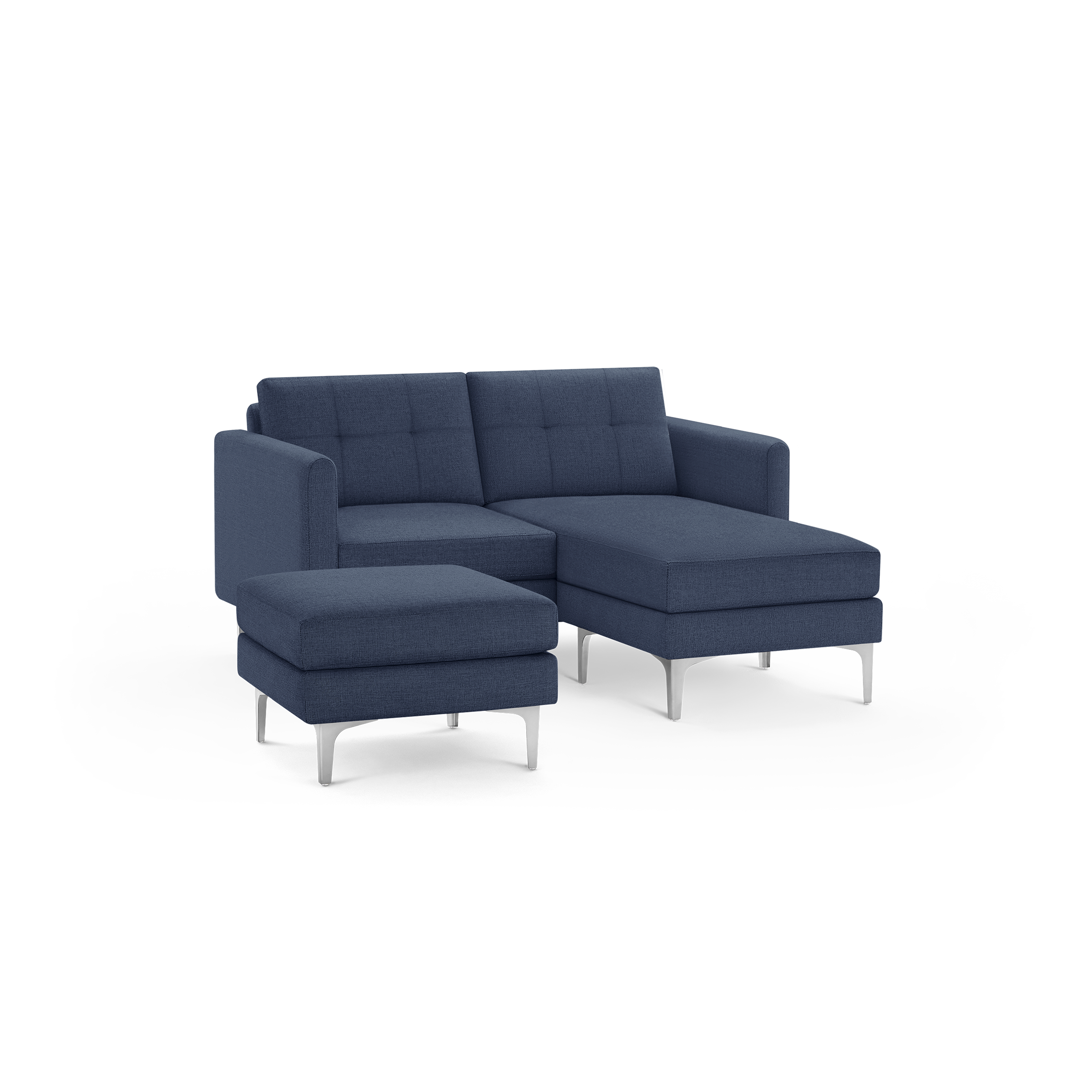 Modern navy blue fabric sectional sofa with chaise lounge and matching ottoman, featuring tufted back cushions and slim metal legs.