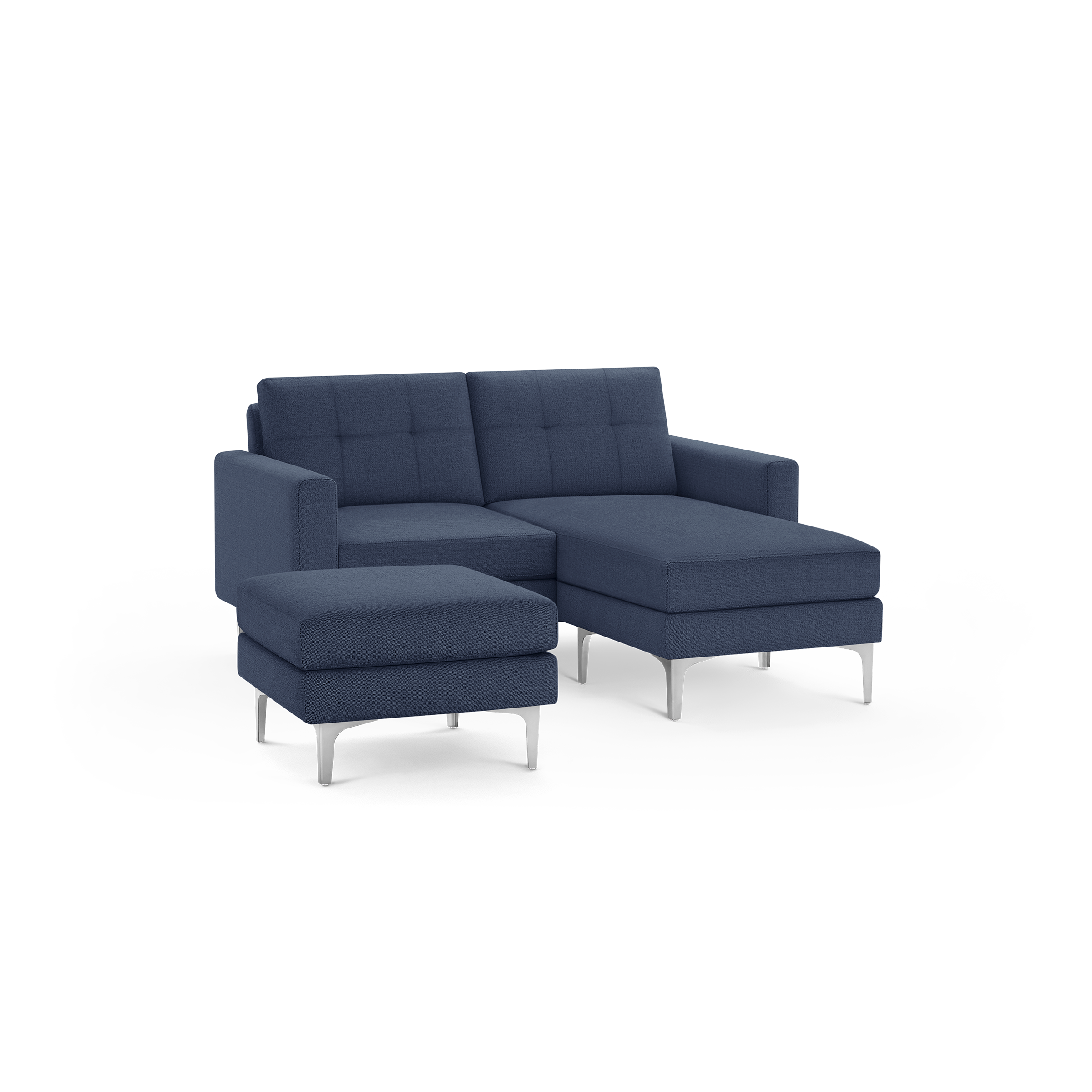 Modern navy blue upholstered sectional sofa with tufted backrest and separate ottoman on sleek silver legs.