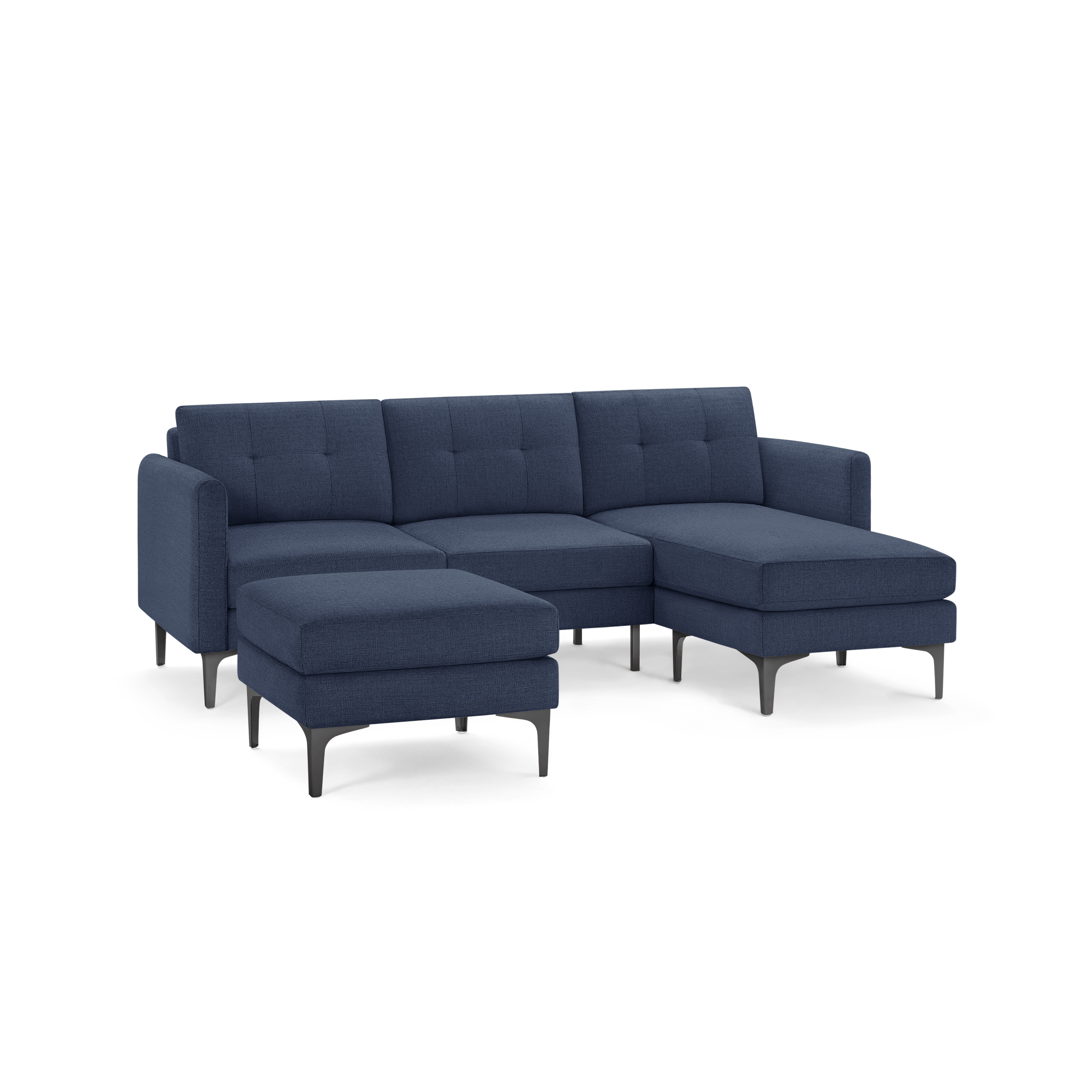 Modern navy blue sectional sofa with metal legs, tufted back cushions, and a matching ottoman.