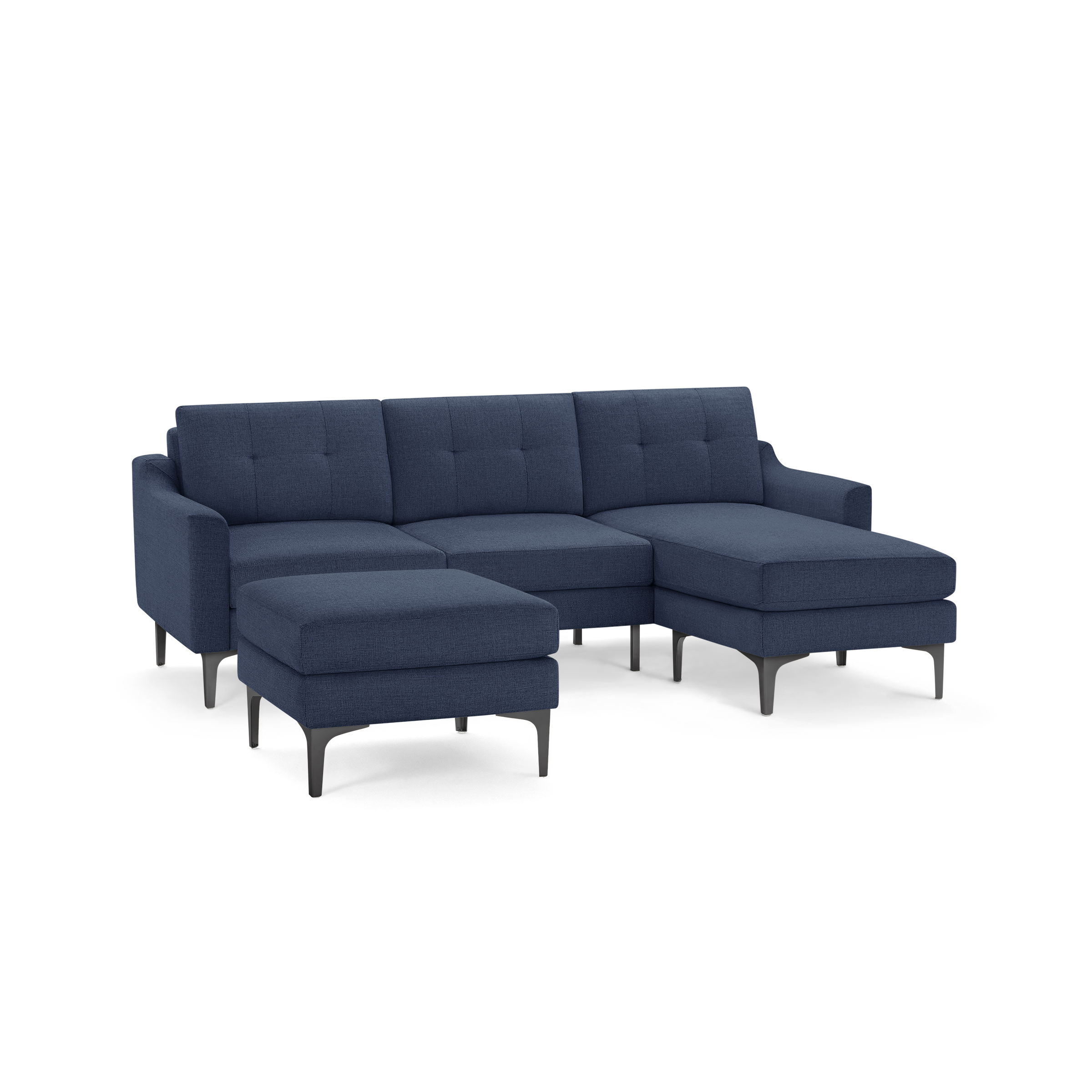Dark blue modern sectional sofa with chaise lounge and matching ottoman, featuring tufted cushions and slender metal legs.