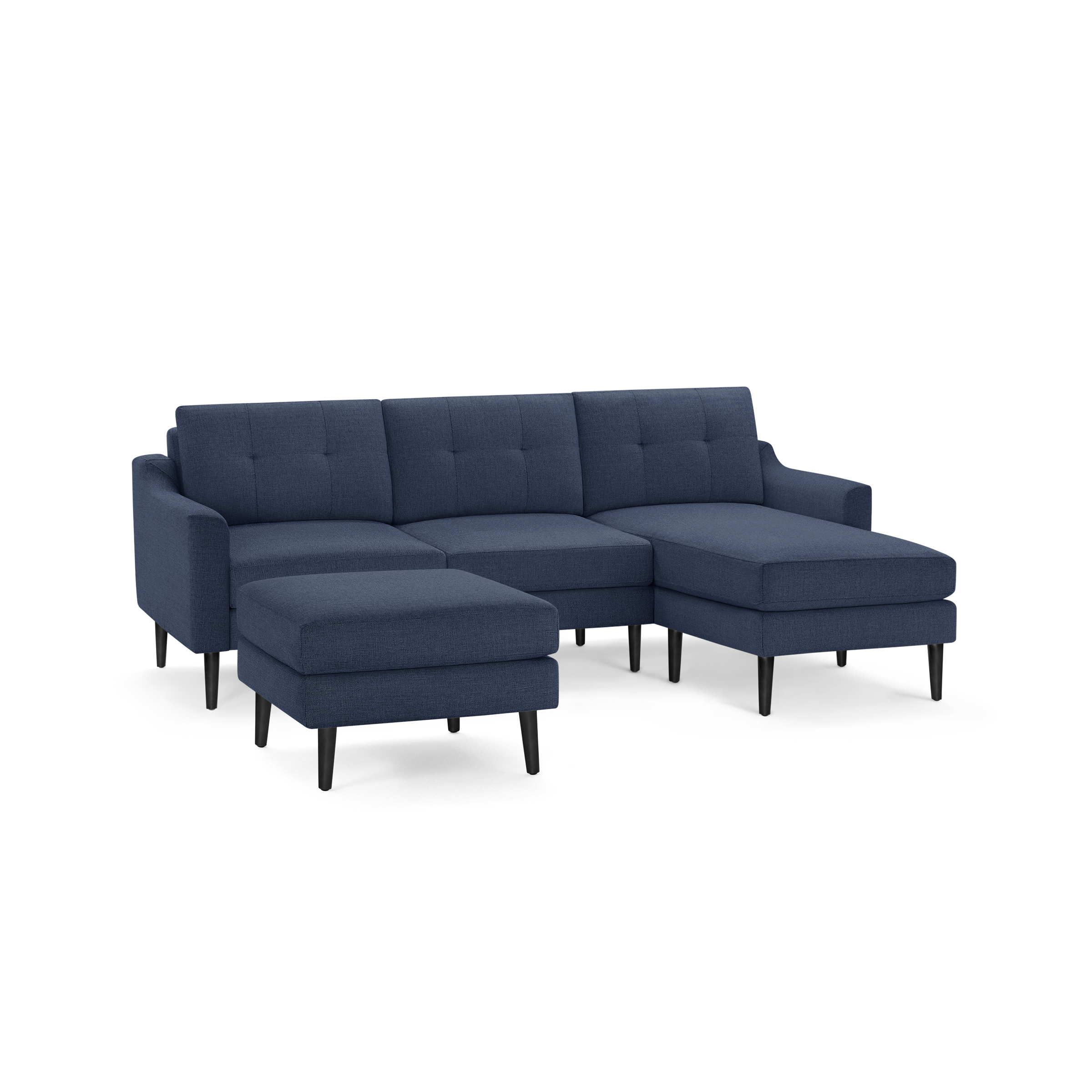 Modern navy blue sectional sofa with tufted back cushions, black tapered legs, and a matching ottoman on a white background.