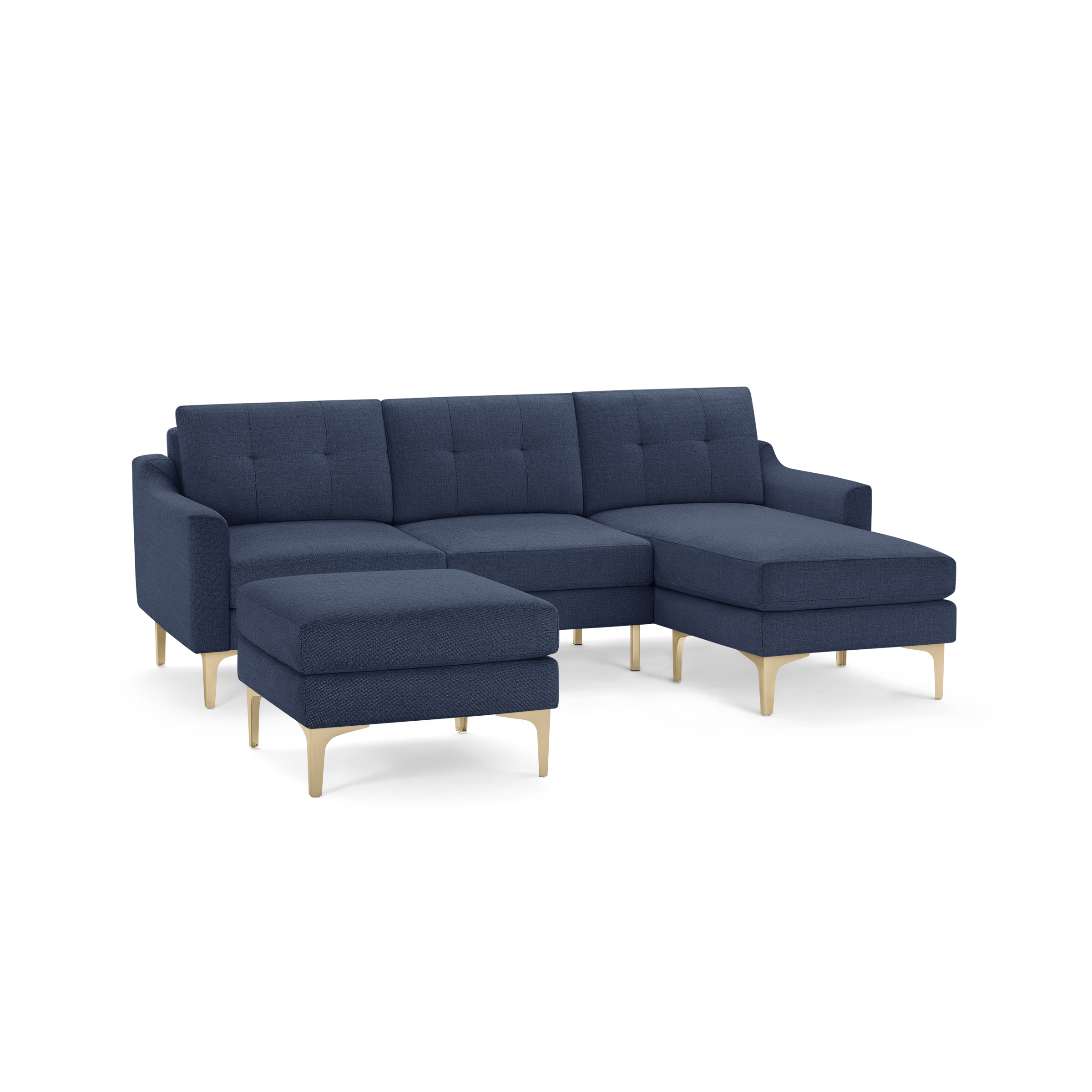 Modern navy blue sectional sofa with tufted cushions, wooden legs, and a matching ottoman.