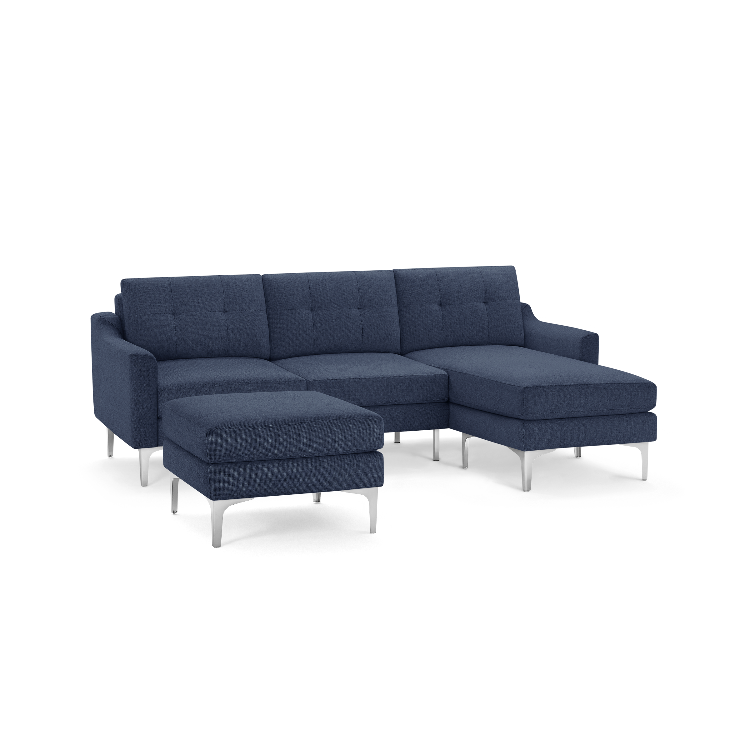 Modern navy blue sectional sofa with tufted cushions, metal legs, and a matching ottoman, isolated on white background.