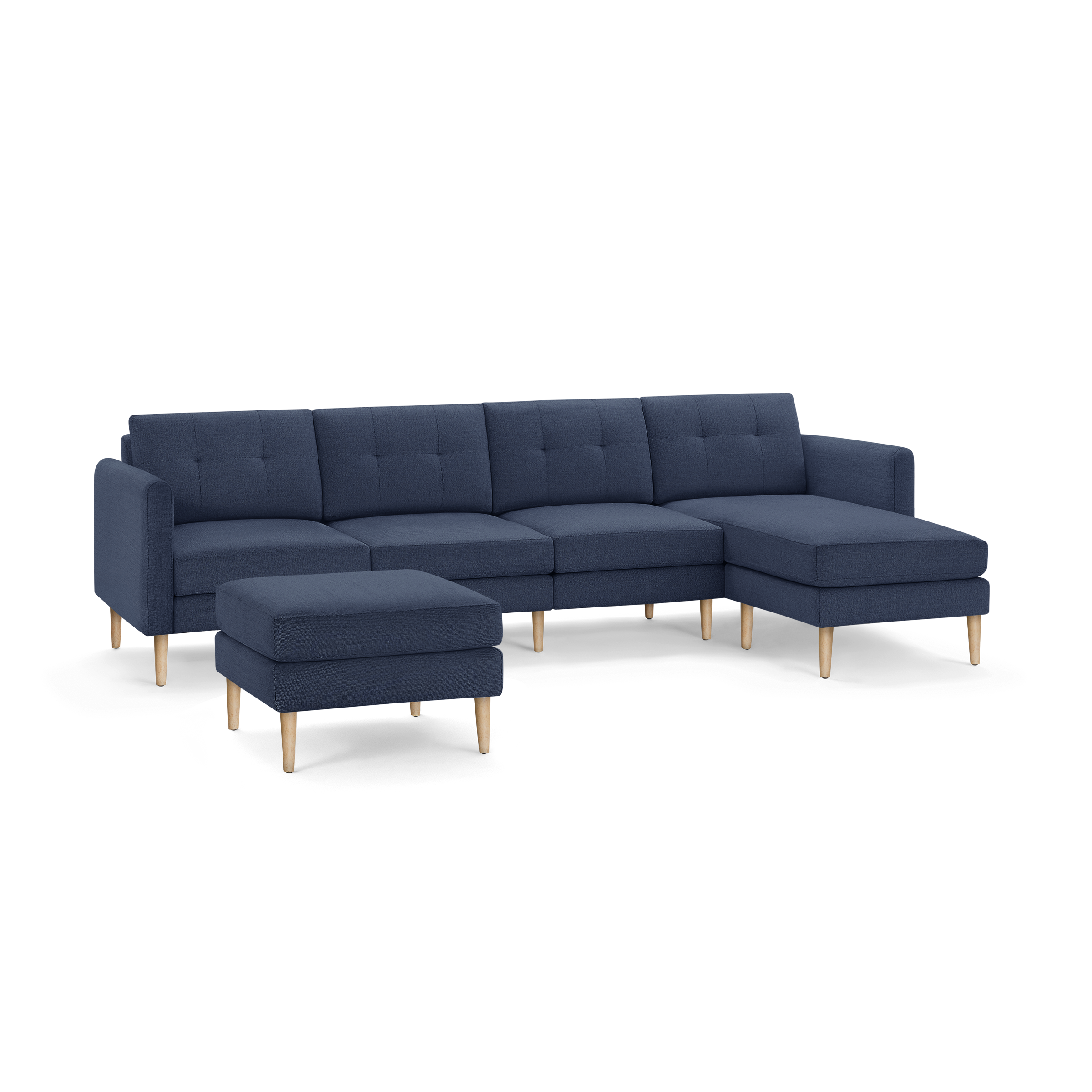 Dark blue modern sectional sofa with tufted back cushions and light wooden legs, featuring an ottoman and chaise lounge.
