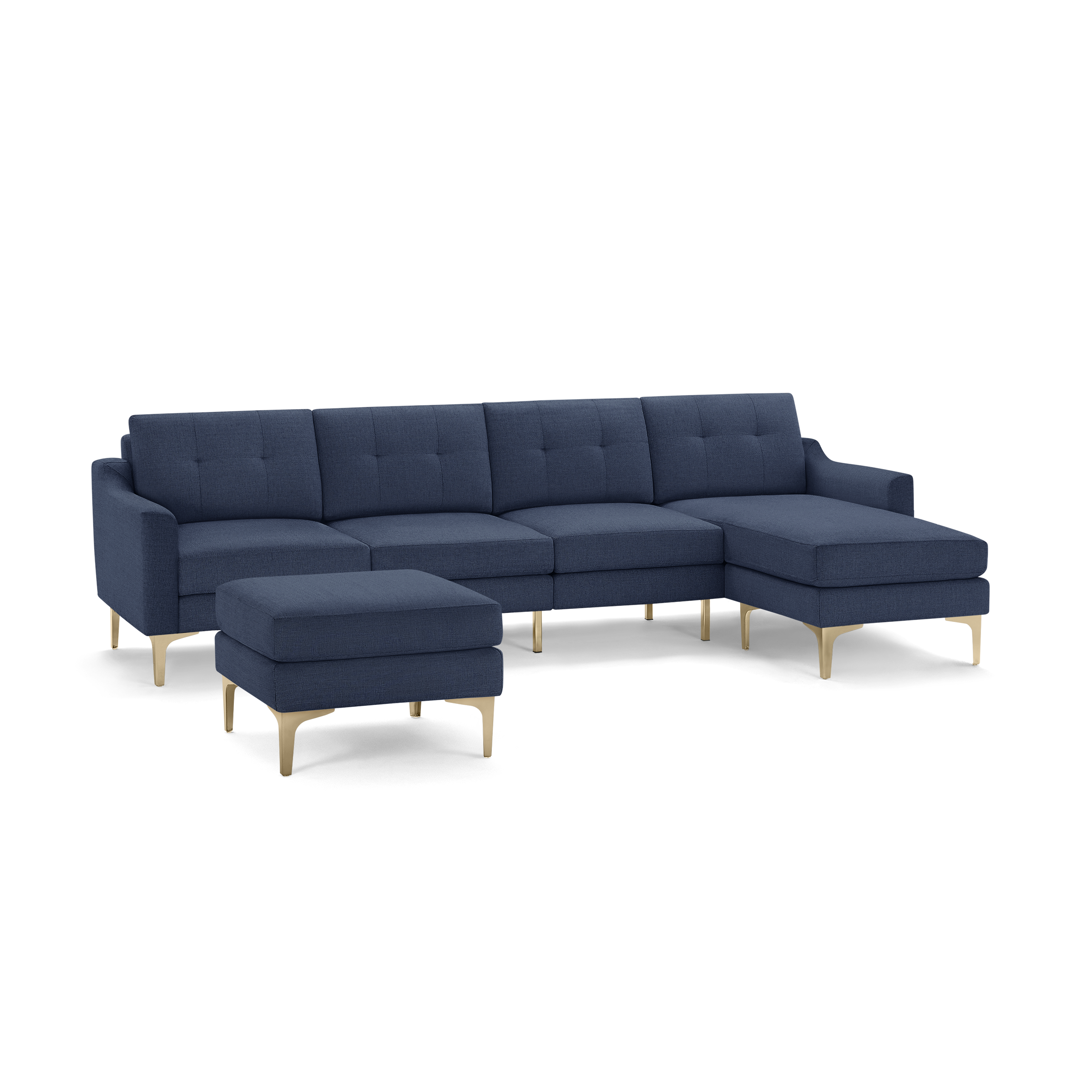 Navy blue sectional sofa with tufted cushions, wooden legs, and matching ottoman, featuring a chaise lounge on the right side.
