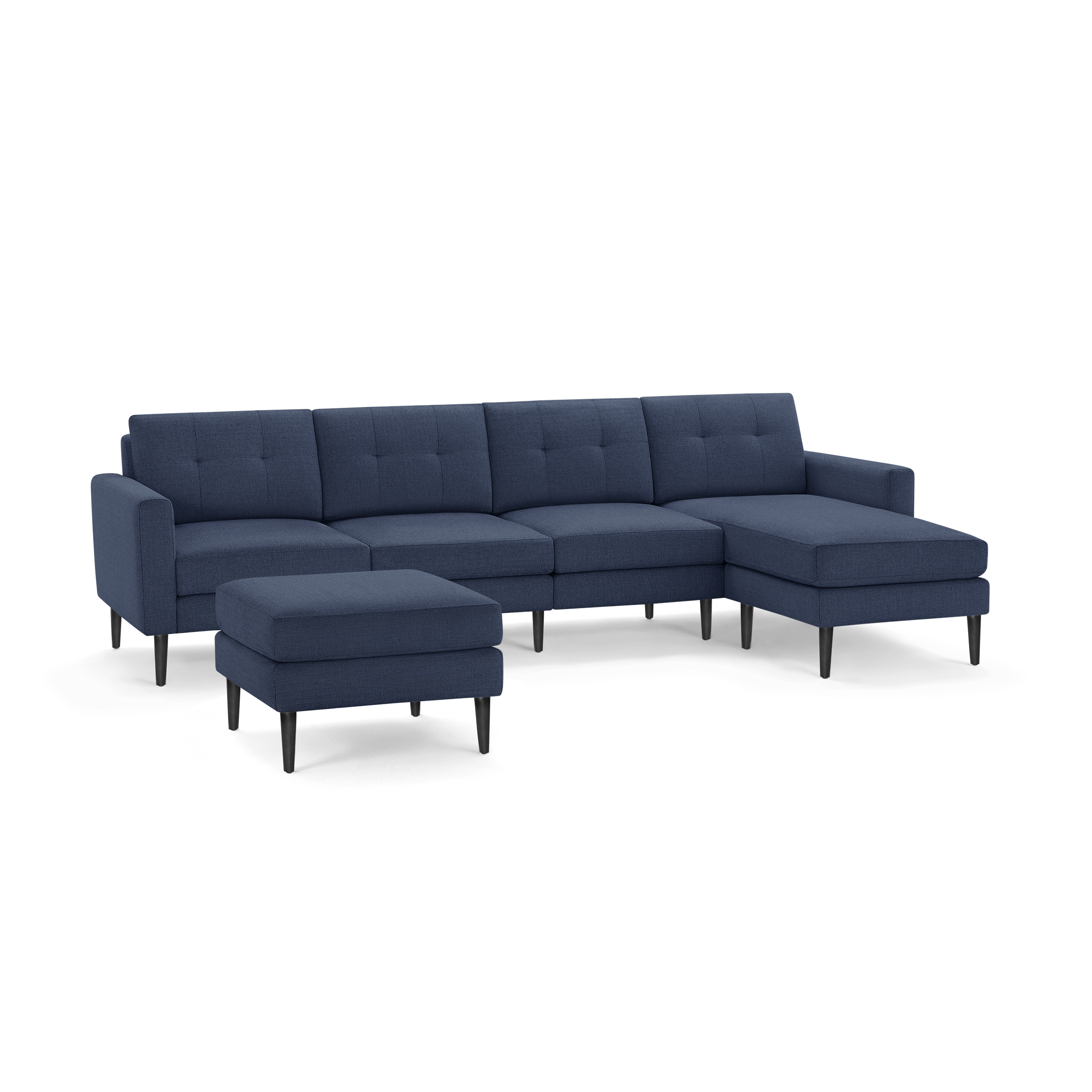 Modern navy blue sectional sofa with tufted back cushions, chaise lounge on right, and matching ottoman, featuring black tapered legs.