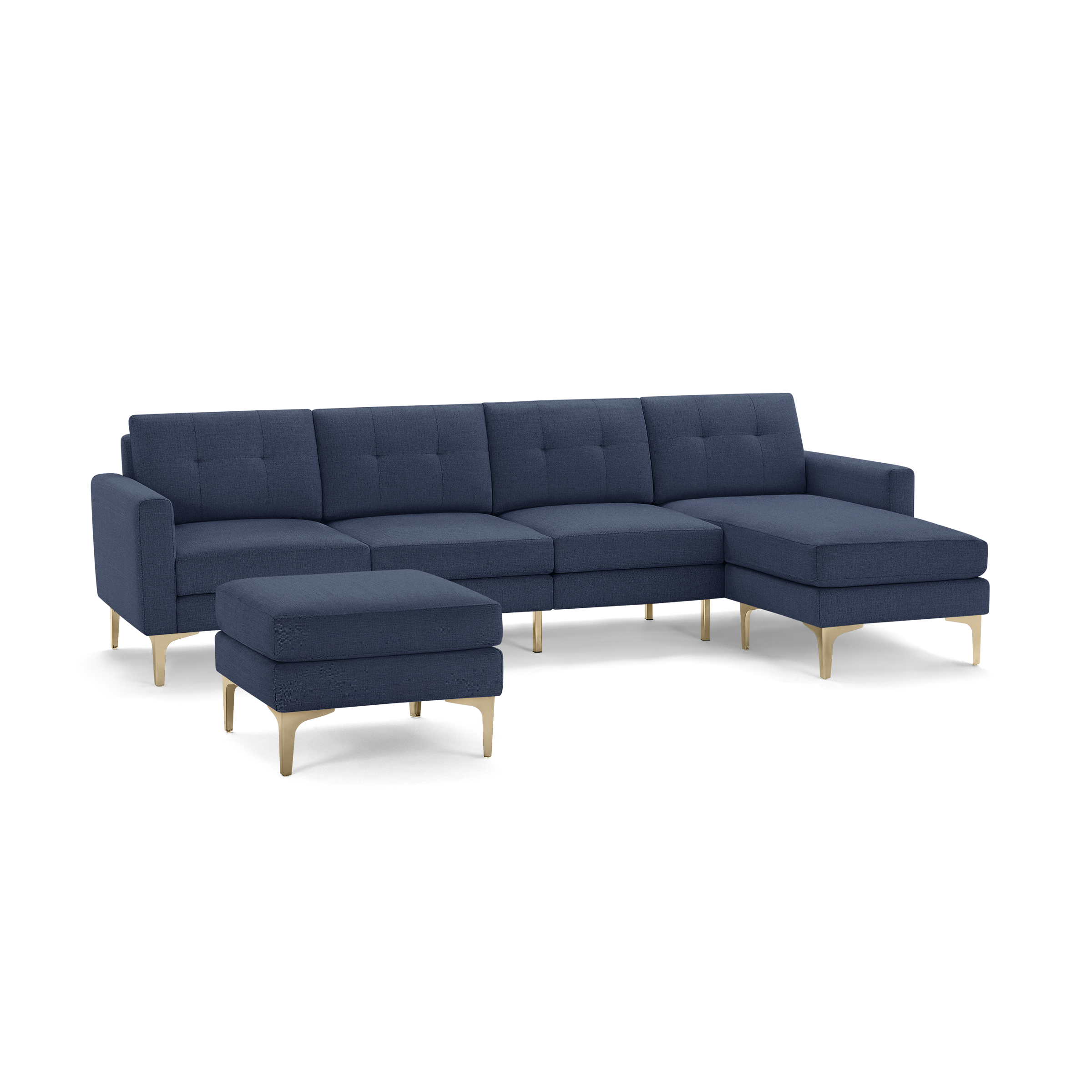 Modern navy blue sectional sofa with tufted back cushions and matching ottoman, featuring light wood legs and chaise lounge.