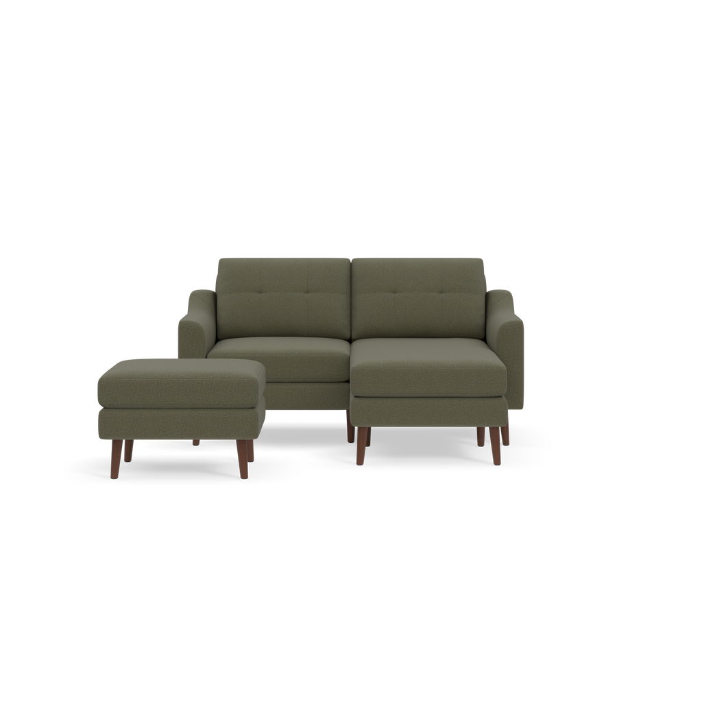 Compact Moss green sectional sofa and matching ottoman with wooden legs, featuring cushioned seats and tufted backrests.