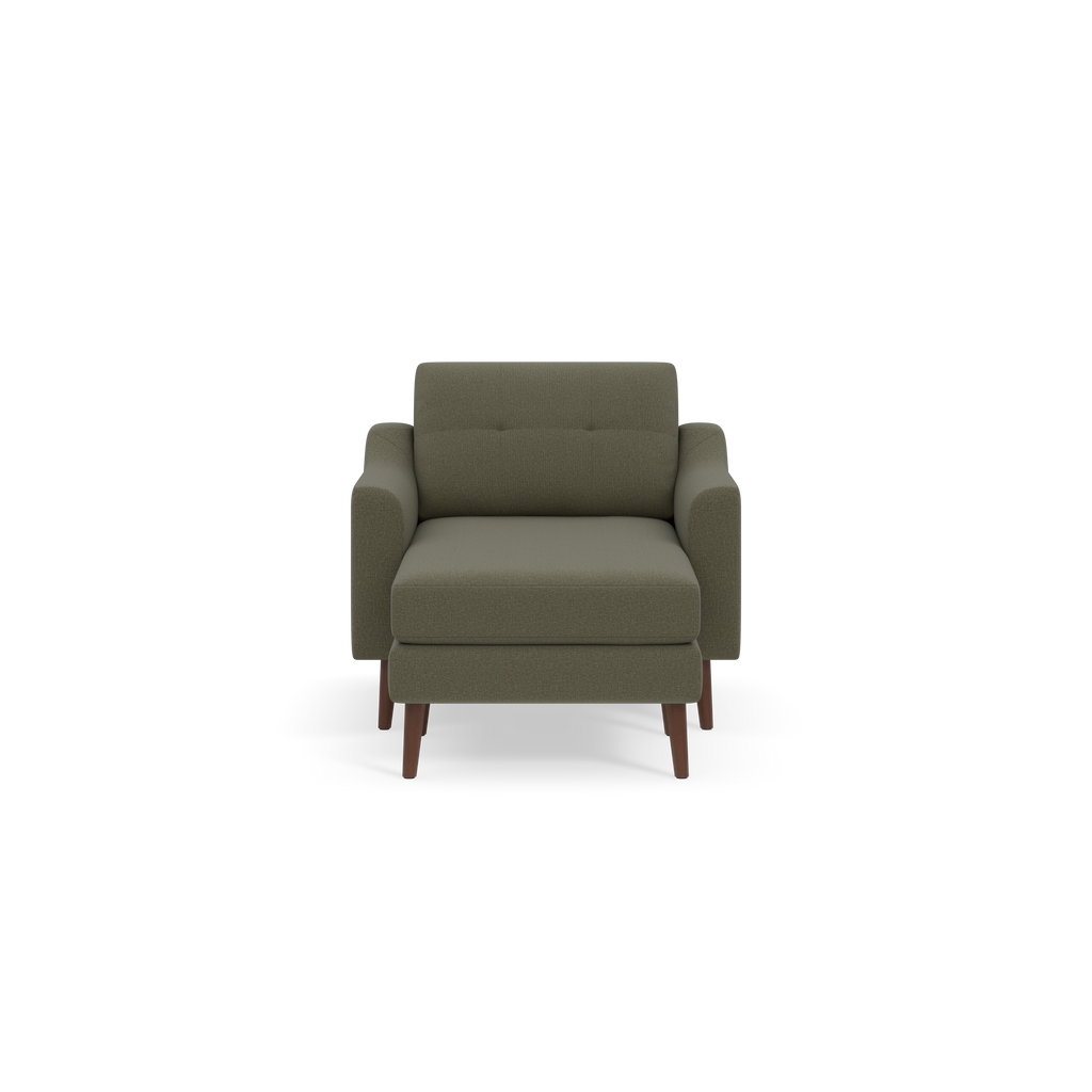 Moss green upholstered armchair with cushioned back and seat, featuring wooden tapered legs, shown on black background.