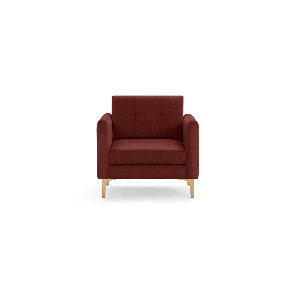 Front view of a modern burgundy upholstered armchair with square tufted backrest and light wooden legs.