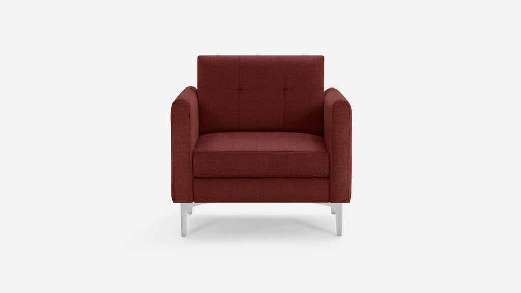 Modern armchair upholstered in rich burgundy fabric, featuring tufted backrest and sleek silver metal legs.