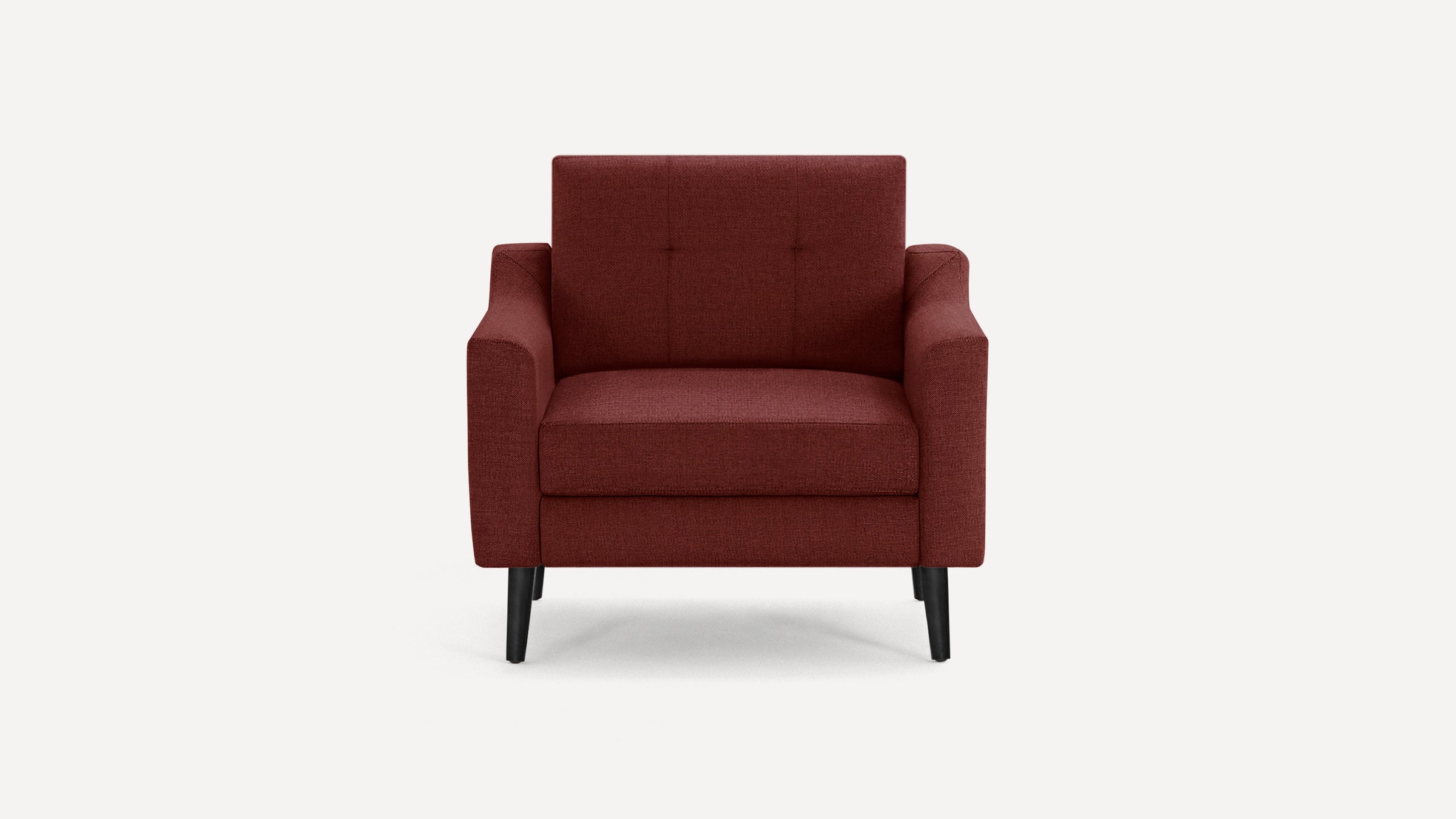 Front view of a modern burgundy upholstered armchair with black tapered legs and simple tufted backrest.