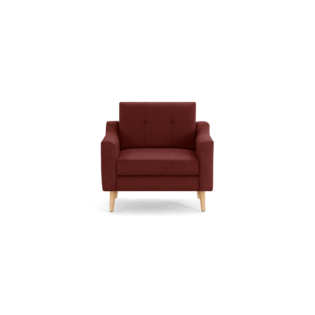 Front view of a modern, deep red fabric armchair with tufted backrest and light wooden legs.
