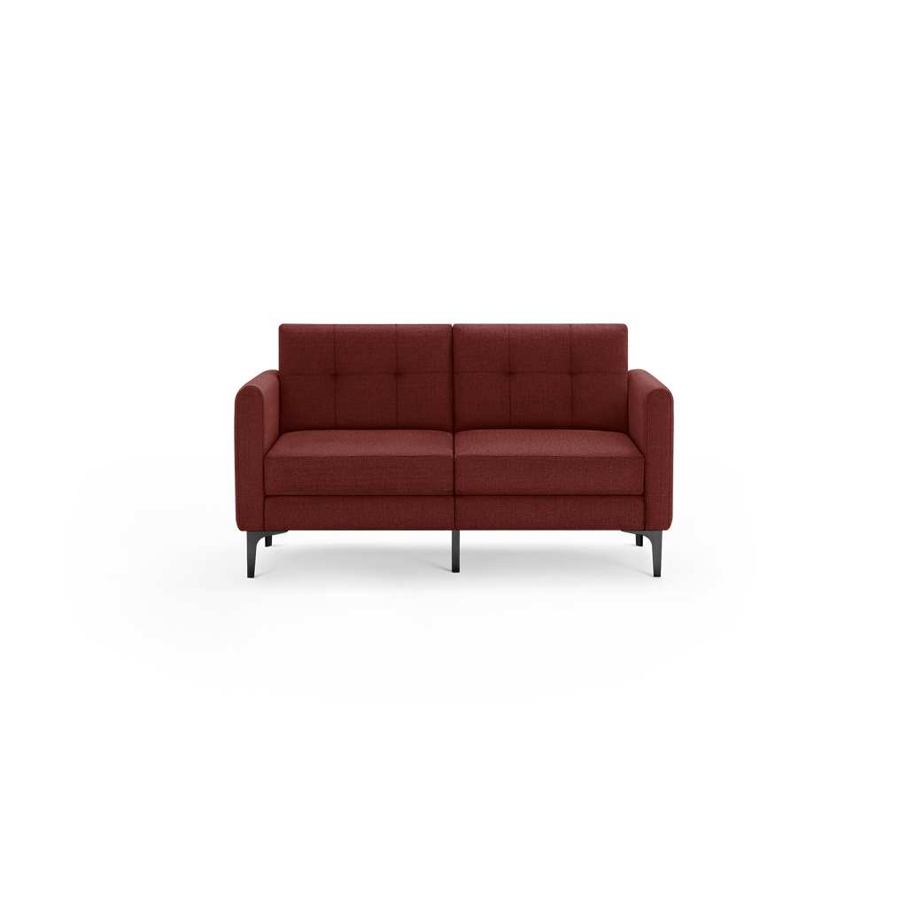 Modern two-seater sofa with tufted dark red fabric upholstery, square arms, and sleek black metal legs on a plain background.