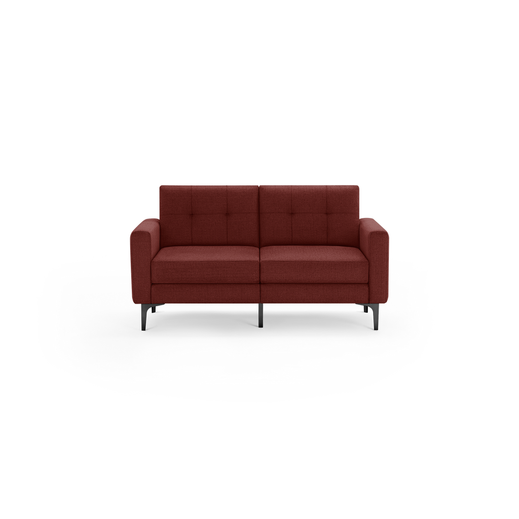 Modern two-seater sofa upholstered in dark red fabric with a tufted backrest and slim black metal legs.