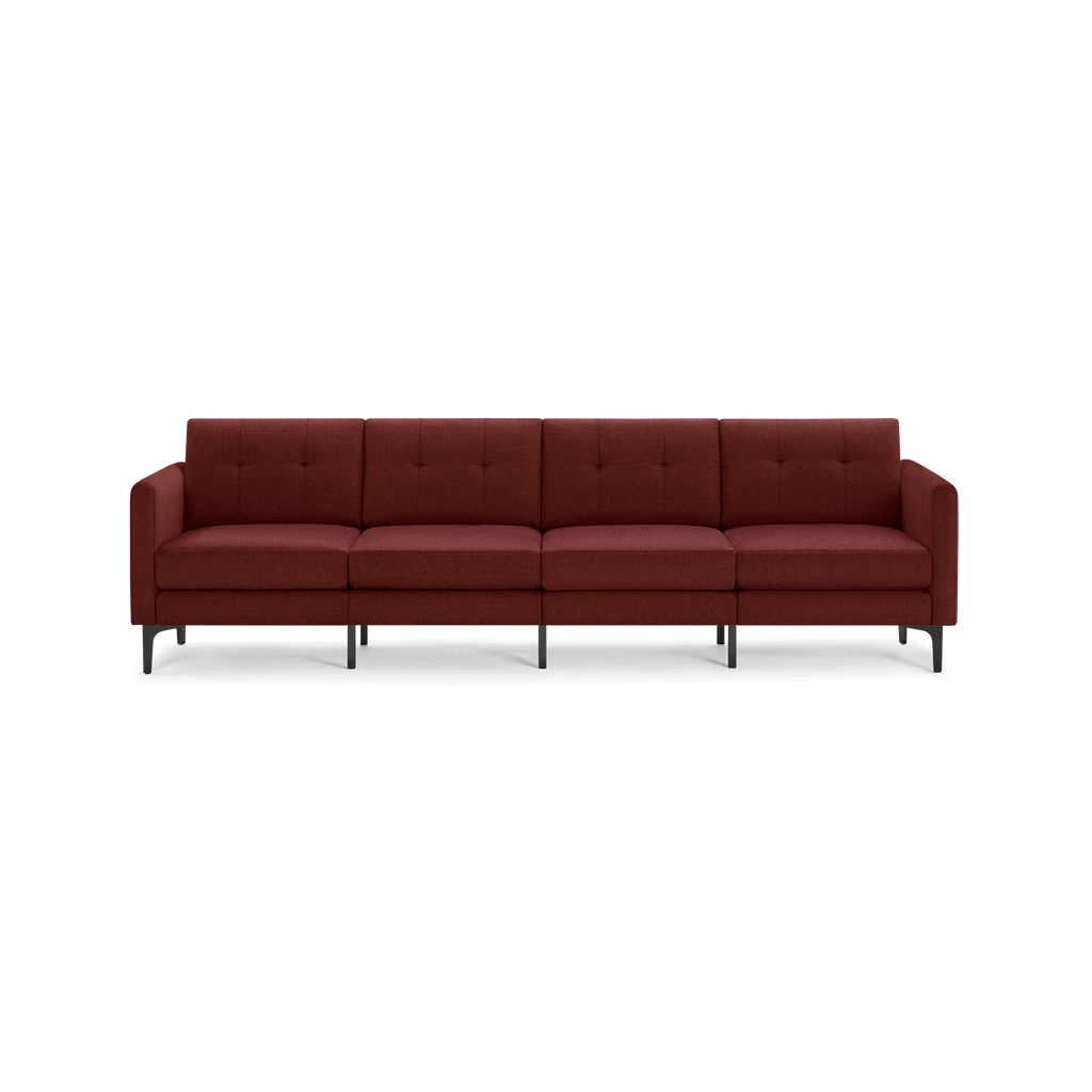 Four-seater modern sofa with deep red fabric upholstery, button-tufted backrests, and slim black metal legs.