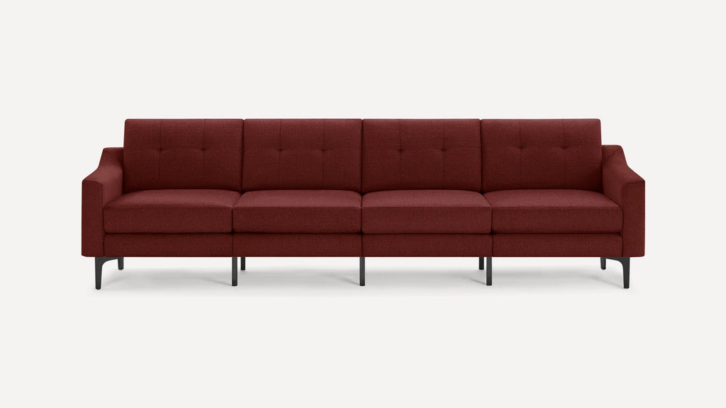 Modern four-seat sofa with deep red fabric upholstery, tufted cushions, sleek armrests, and black metal legs on a white background.