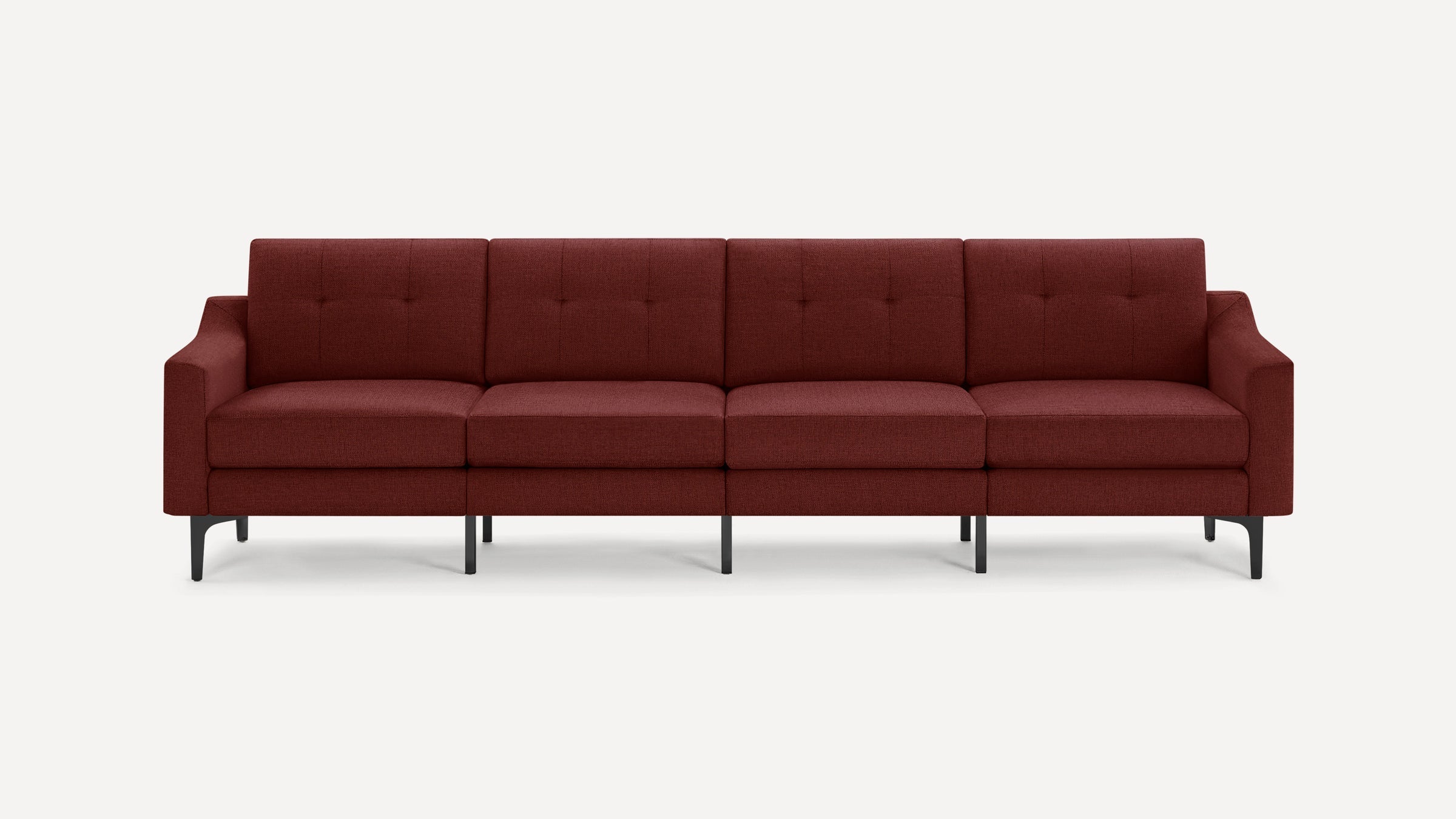 Modern four-seat sofa with deep red fabric upholstery, tufted cushions, sleek armrests, and black metal legs on a white background.