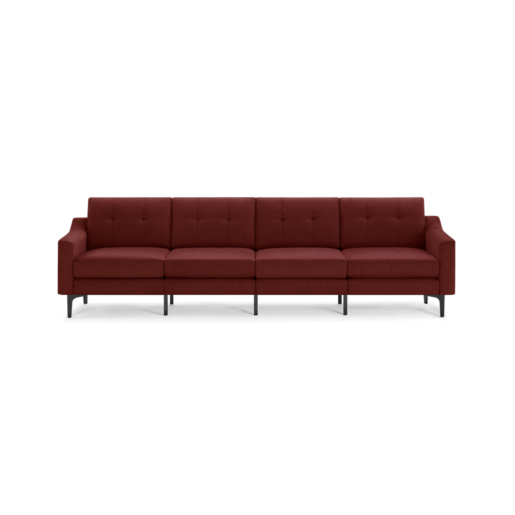 Four-seater modern sofa upholstered in deep red fabric with tufted back cushions and black angled legs.