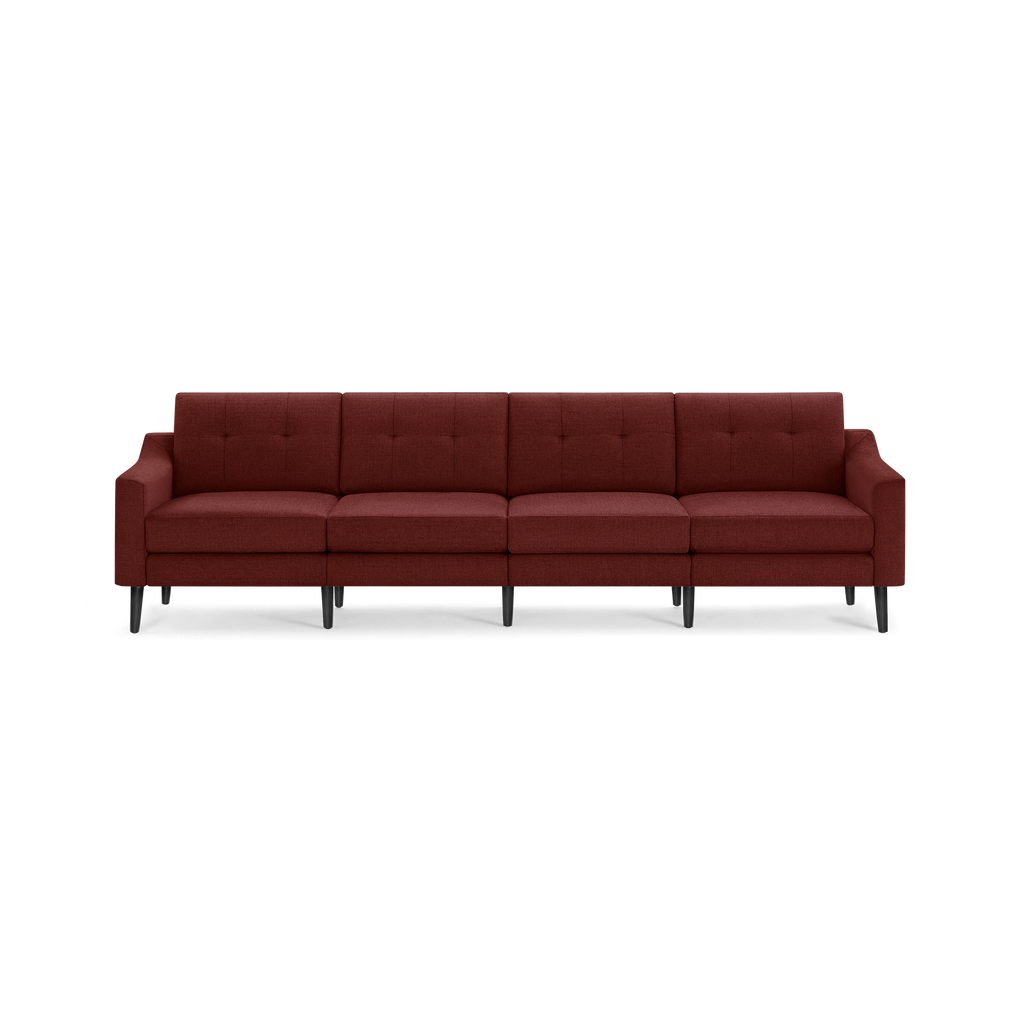 Four-seater modern sofa with tufted back cushions, deep reddish-brown fabric upholstery, and sleek black legs.