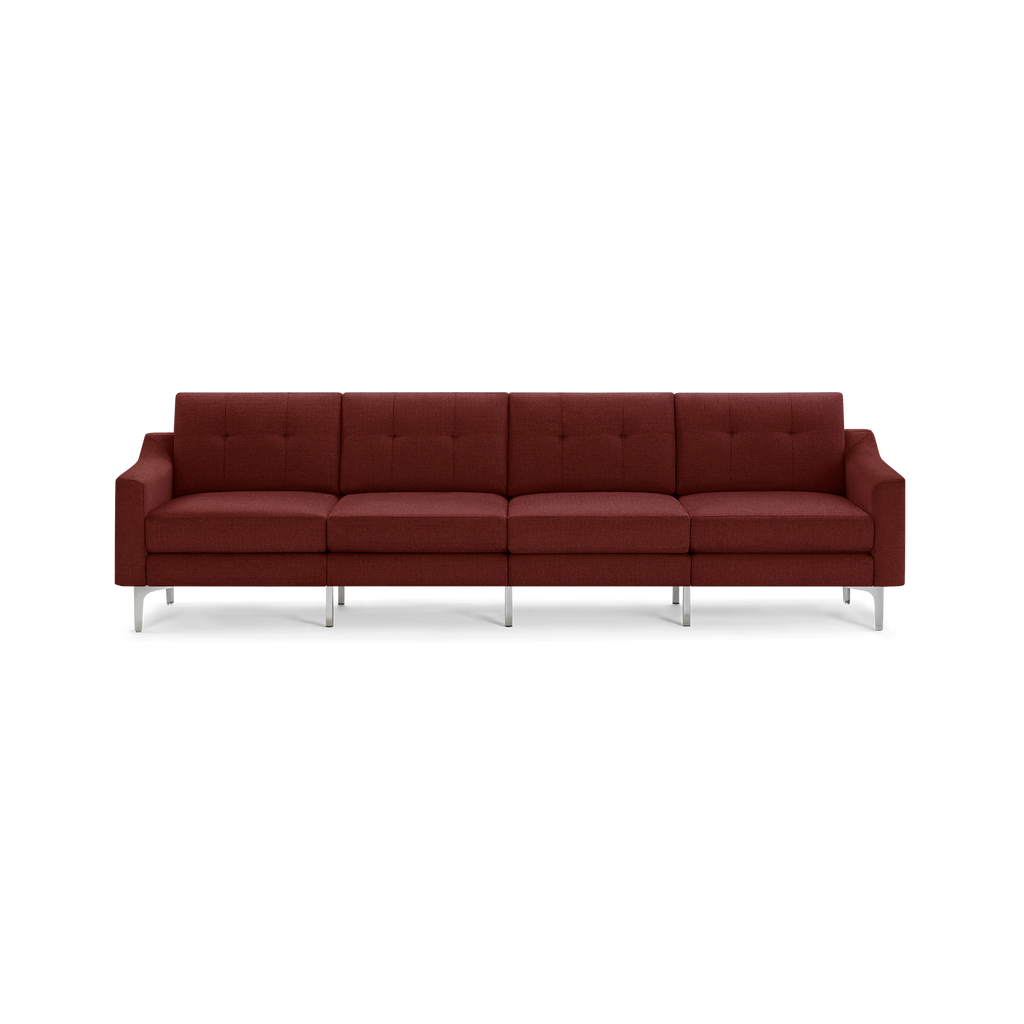 Modern four-seater sofa with tufted cushions, upholstered in deep red fabric, featuring square arms and silver metal legs.