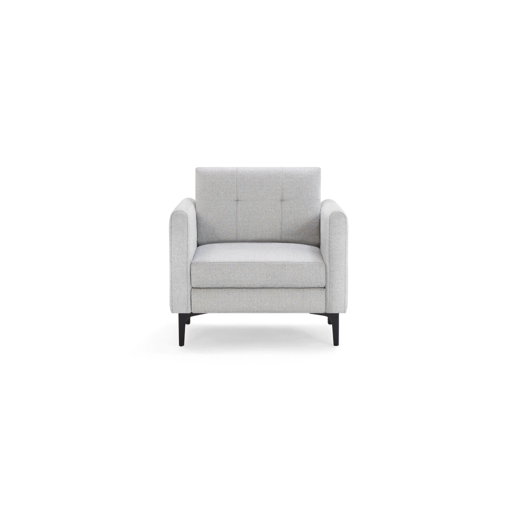 Light gray fabric armchair with tufted backrest, cushioned seat, rounded armrests, and slim black legs, shown front view.