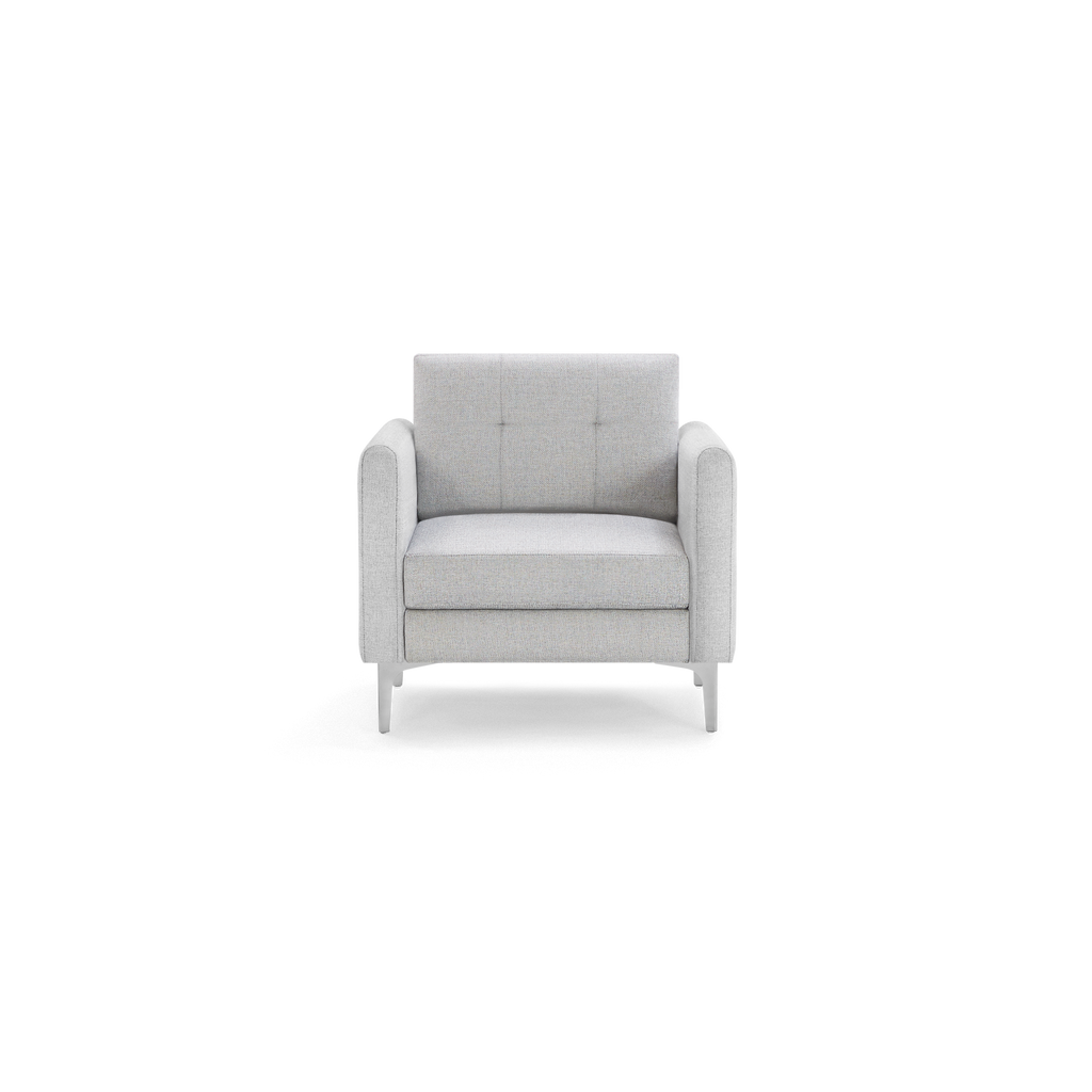 Modern single-seat armchair with light gray fabric upholstery, square backrest with subtle tufting, padded arms, and sleek metal legs.