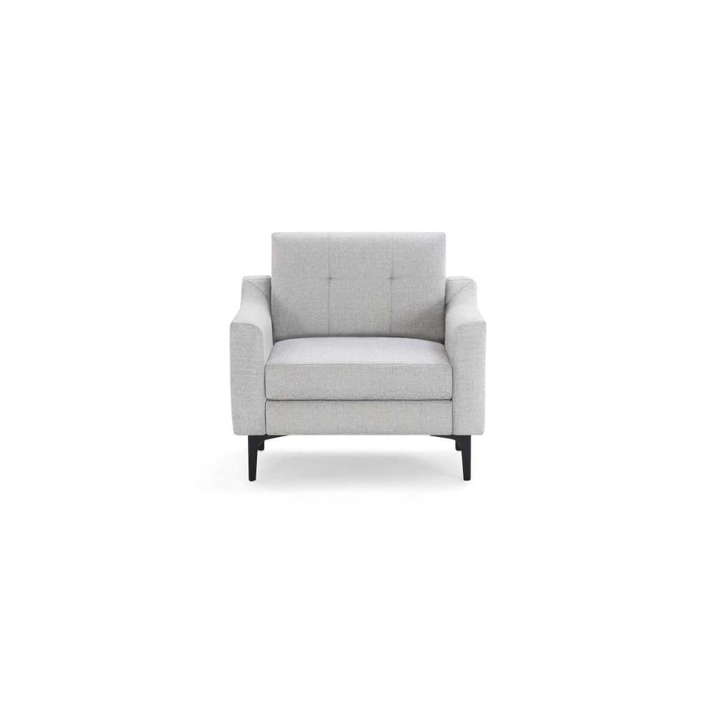 Light gray modern armchair with cushioned seat, button tufted backrest, wide armrests, and black metal legs.