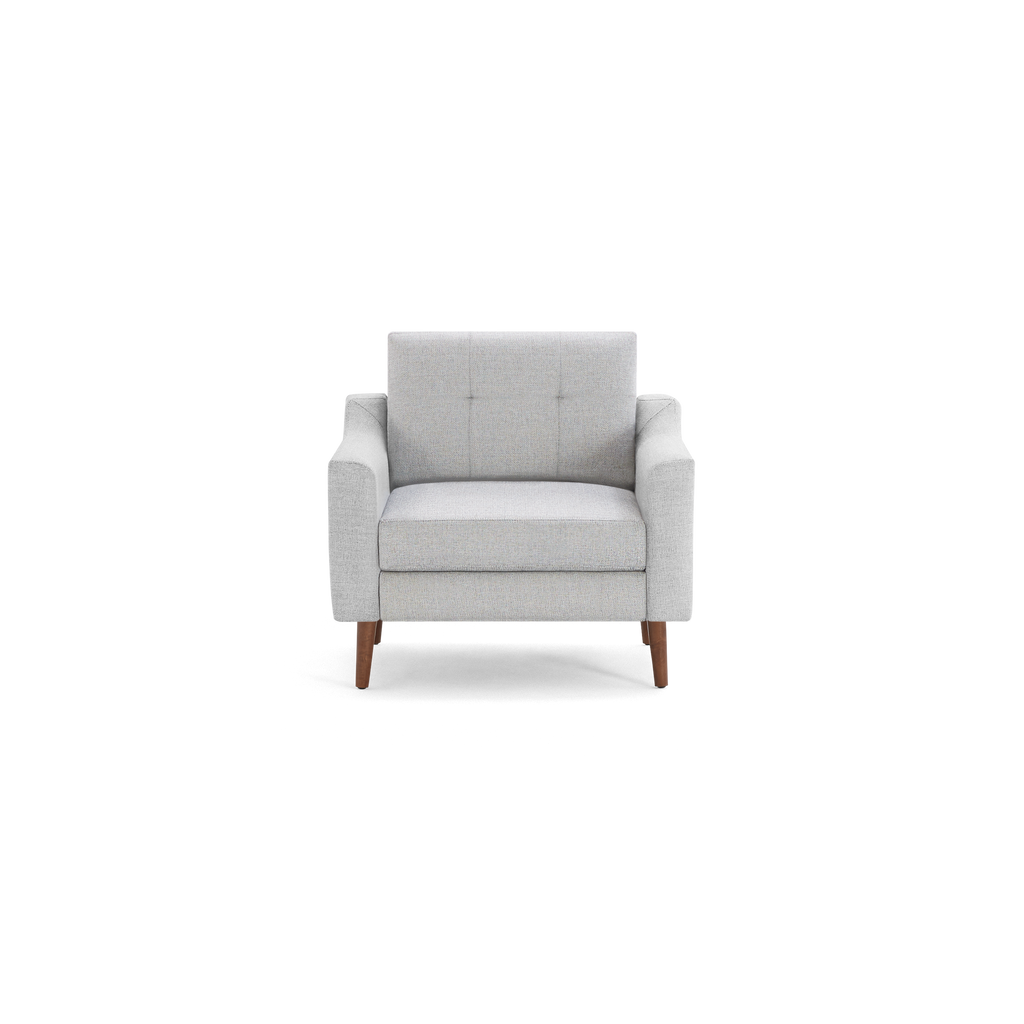 Light gray upholstered armchair with tufted backrest, wide arms, and wooden tapered legs, modern and stylish design.